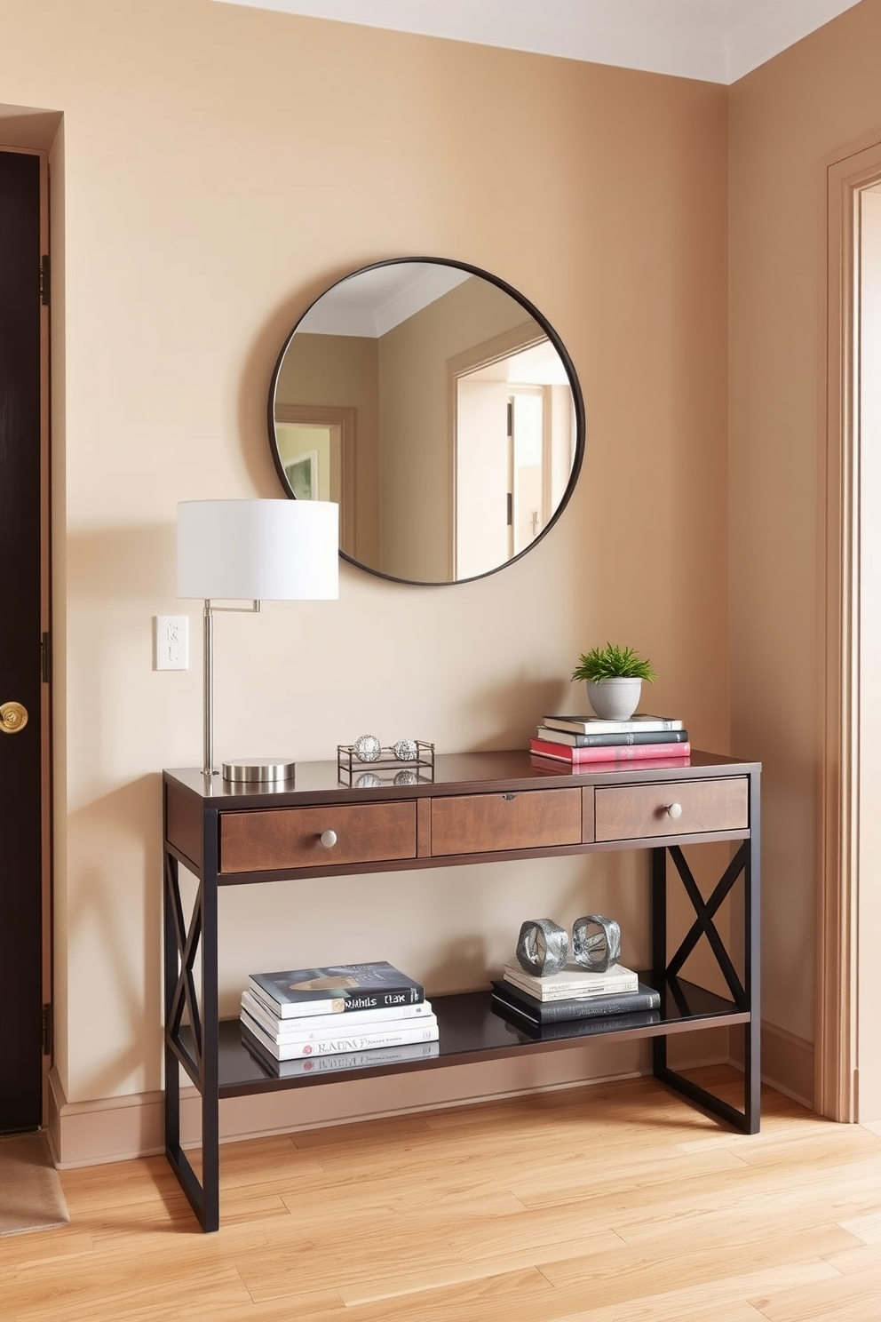 A stylish console table is positioned against the wall in a townhouse entryway. It is adorned with decorative accents such as a sleek lamp, a small potted plant, and a few art books stacked neatly. The walls are painted in a warm neutral tone, enhancing the inviting atmosphere. A round mirror hangs above the console, reflecting light and adding depth to the space.