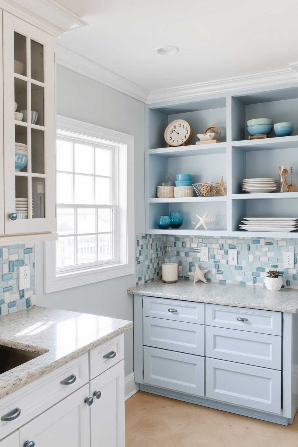 A coastal-themed townhouse kitchen features light blue accents throughout the space. The cabinetry is a soft white with light blue hardware, and the backsplash is a mosaic of sea glass tiles in varying shades of blue and green. The countertops are a light granite that mimics the sandy beach, while open shelving displays beach-themed decor and dishware. Large windows allow natural light to flood the room, highlighting the airy and relaxed atmosphere.