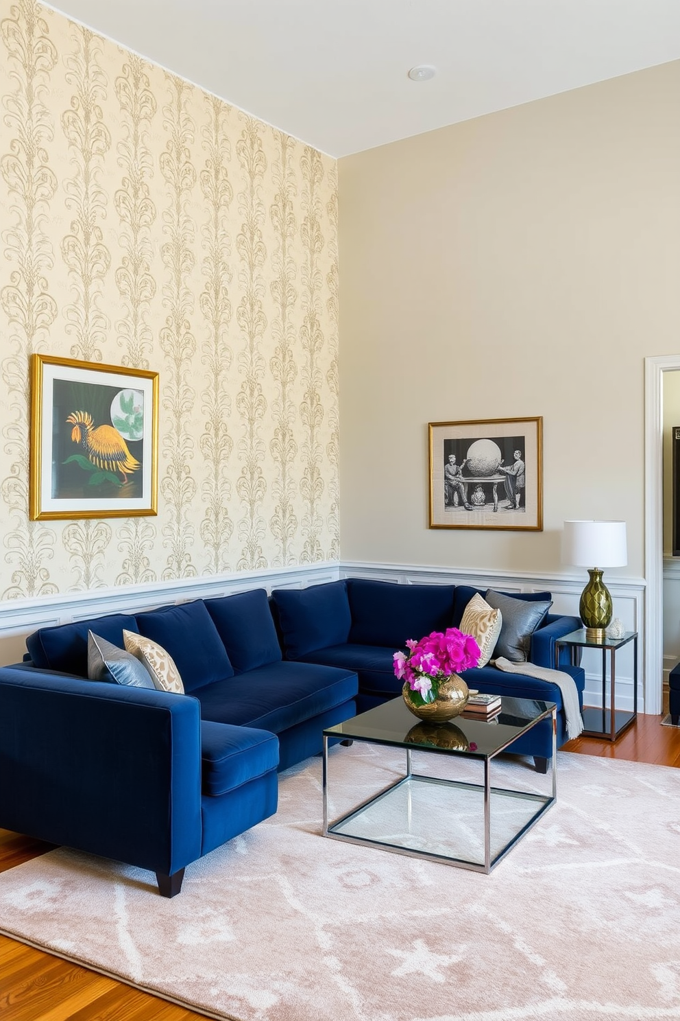 A stylish townhouse living room features an accent wall adorned with elegant wallpaper showcasing a subtle floral pattern. The rest of the walls are painted in a soft, neutral tone that complements the rich hues of the furniture. The room includes a plush sectional sofa in a deep navy blue, paired with a sleek glass coffee table. A large area rug with geometric designs anchors the seating area, adding warmth and texture to the space.