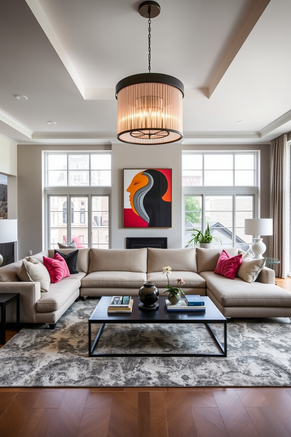 A bold statement light fixture hangs from the ceiling, serving as the centerpiece of the townhouse living room. The space features a plush sectional sofa in a neutral tone, complemented by vibrant accent pillows and a large area rug that anchors the seating arrangement. Floor-to-ceiling windows allow natural light to flood the room, highlighting the elegant artwork displayed on the walls. A sleek coffee table sits in front of the sofa, adorned with decorative books and a stylish centerpiece.