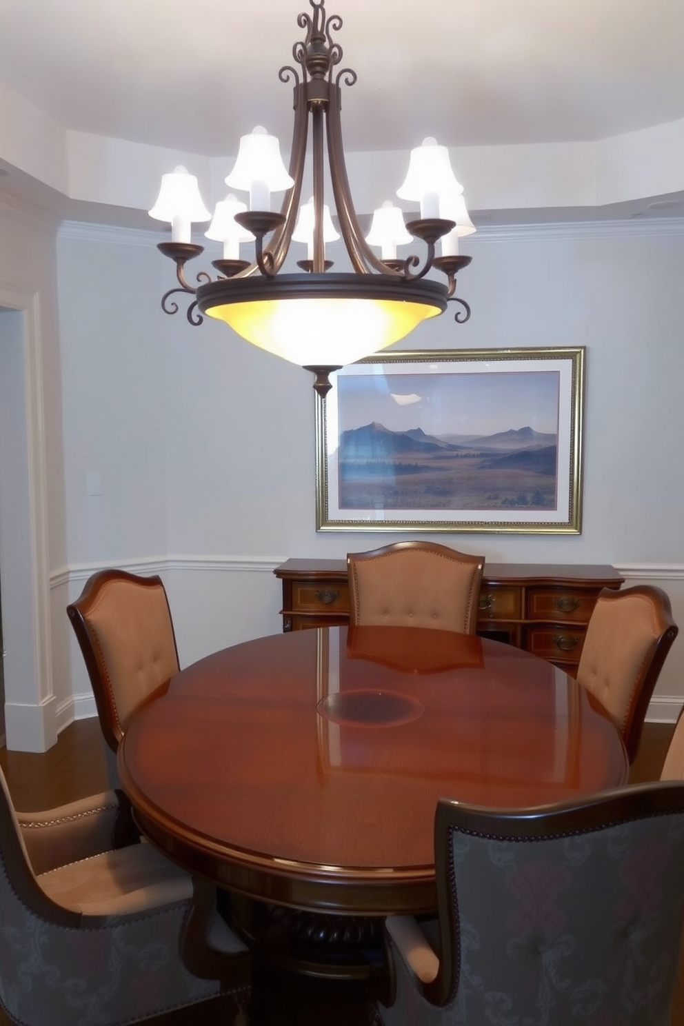 An elegant chandelier hangs gracefully above a polished wooden dining table, casting a warm glow over the room. Surrounding the table are plush upholstered chairs in a rich fabric, creating a welcoming atmosphere for family gatherings. The walls are adorned with soft, muted colors that complement the natural wood tones of the furniture. A large, framed artwork featuring a serene landscape adds a touch of sophistication to the traditional dining room.