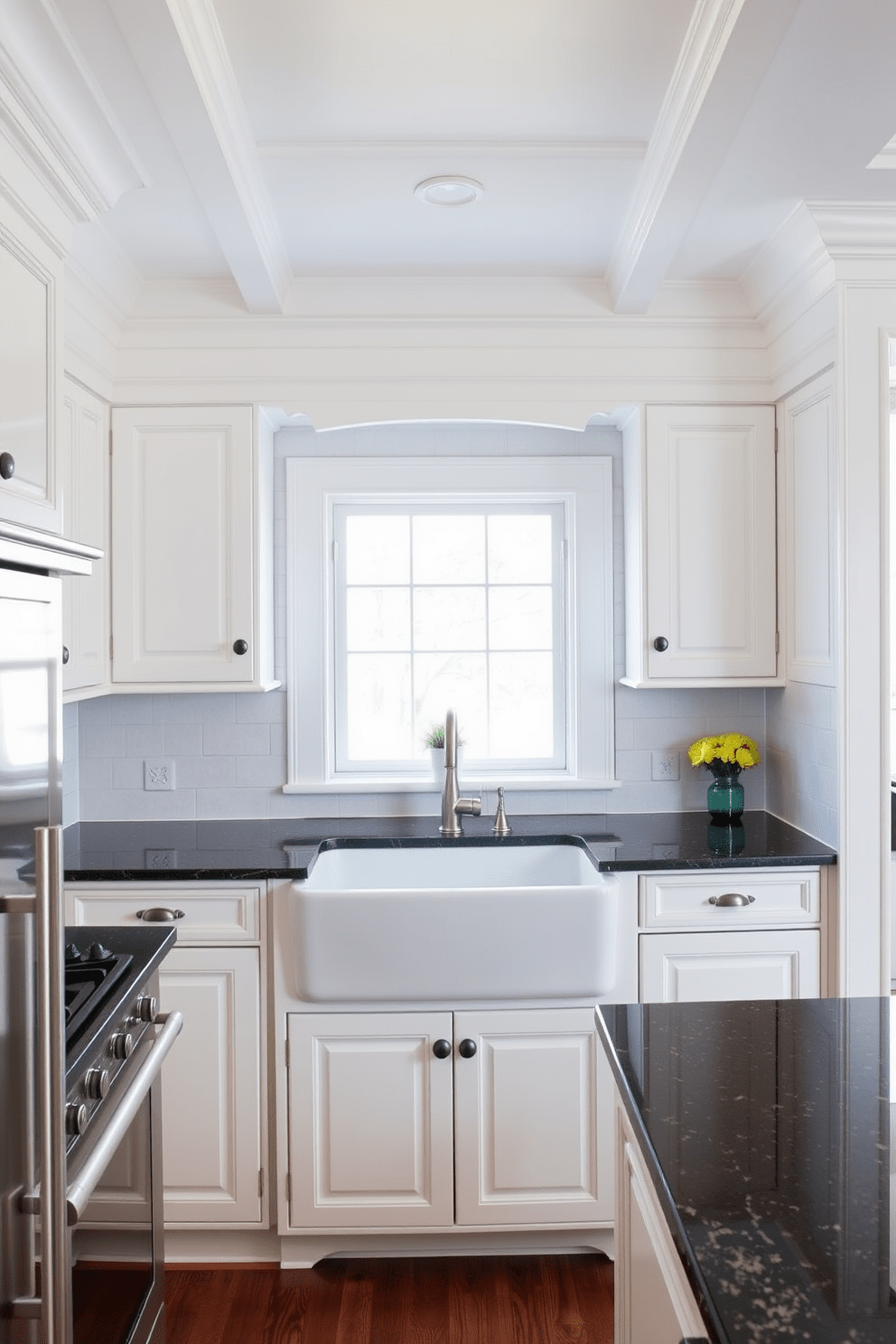 Classic white cabinetry with crown molding creates an elegant focal point in the kitchen. The countertops are a rich dark granite that contrasts beautifully with the cabinetry. A large farmhouse sink is positioned in front of a window, allowing natural light to flood the space. Stainless steel appliances complement the traditional design, providing a modern touch while maintaining the classic aesthetic.