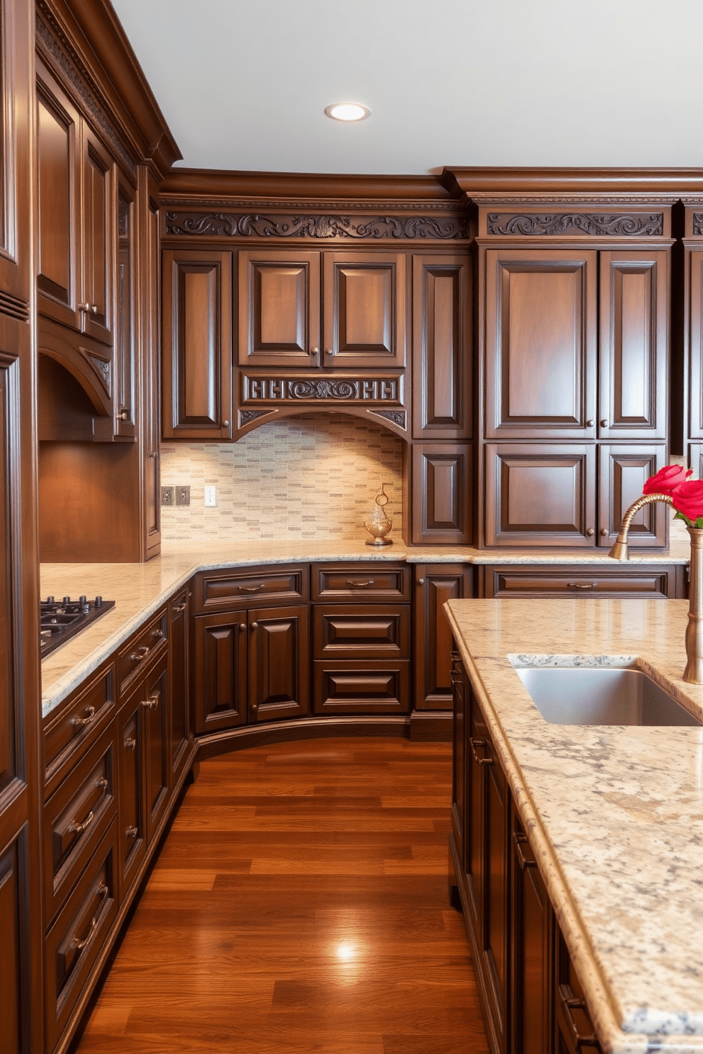 Custom cabinetry features intricate carvings that showcase craftsmanship and elegance. The kitchen is designed with a warm color palette, highlighting rich wood tones and classic detailing. The layout includes a spacious island with a polished granite countertop, perfect for both cooking and entertaining. Antique brass fixtures complement the overall traditional aesthetic, adding a touch of sophistication.