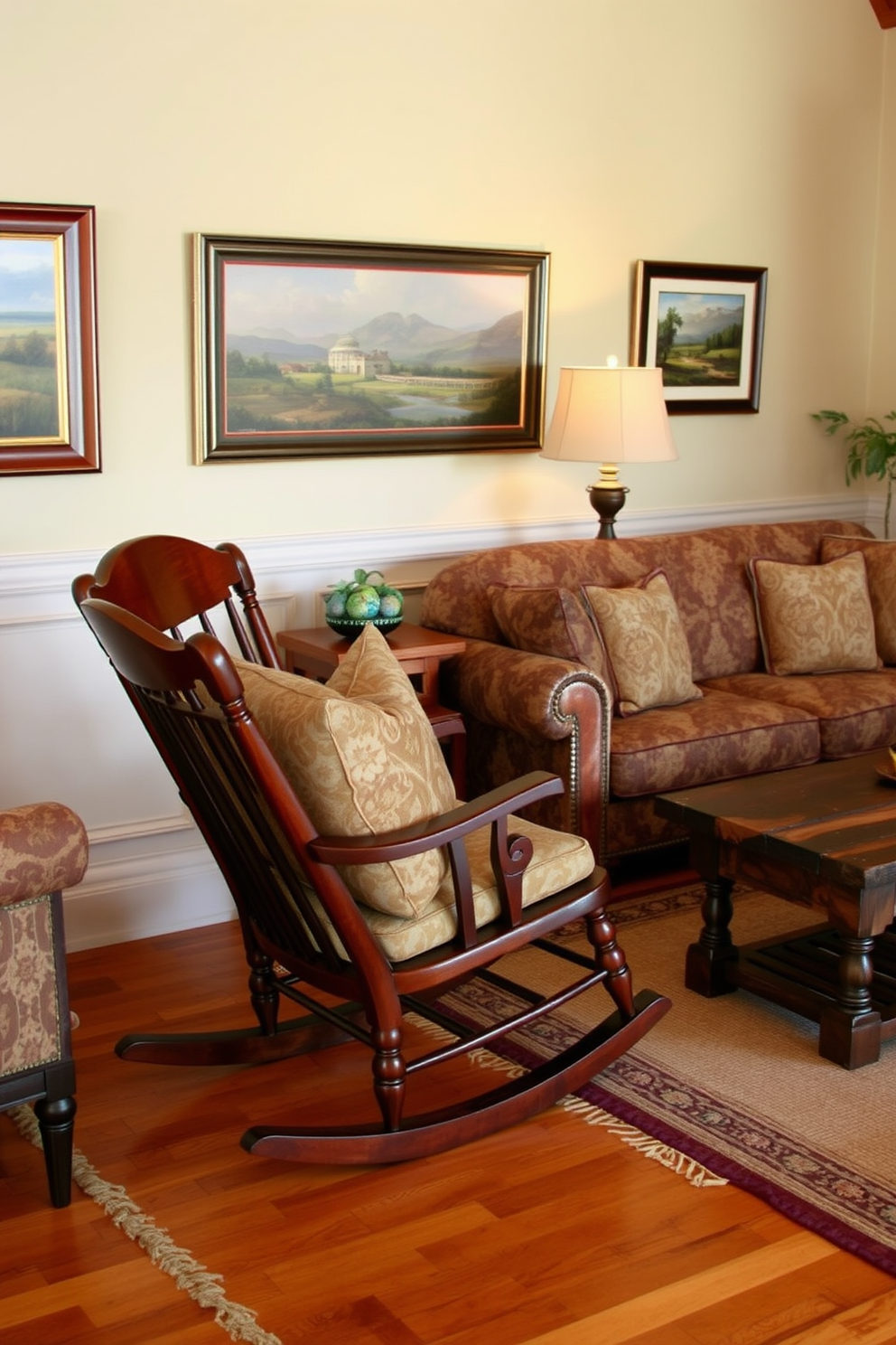 A classic wooden rocking chair is positioned in a cozy corner of the traditional living room. The chair features a rich mahogany finish, complemented by soft, patterned cushions in warm earth tones. Surrounding the rocking chair are elegant furnishings, including a plush sofa with intricate upholstery and a vintage coffee table made of reclaimed wood. The walls are adorned with framed landscape paintings, and a handwoven area rug adds warmth to the hardwood floor.