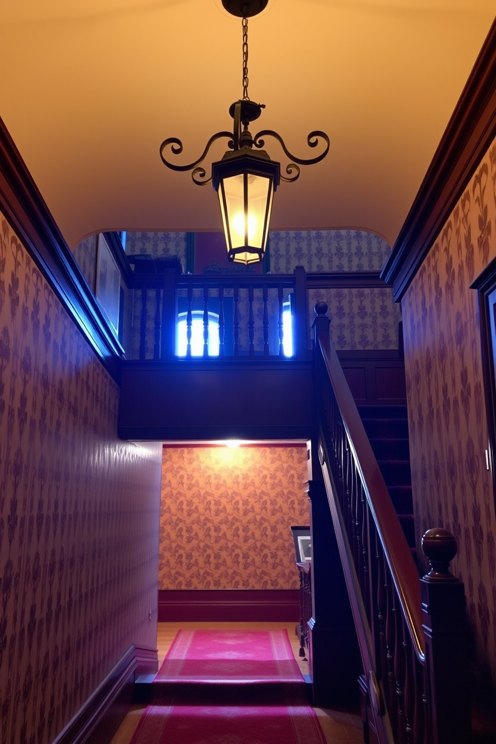 Antique lighting fixtures hang gracefully from the ceiling, casting a warm glow over the elegant staircase. The staircase features rich wooden banisters and intricately carved steps, showcasing timeless craftsmanship. The walls are adorned with vintage wallpaper, enhancing the classic ambiance of the space. A plush runner carpet adds comfort and color, guiding guests up the inviting staircase.