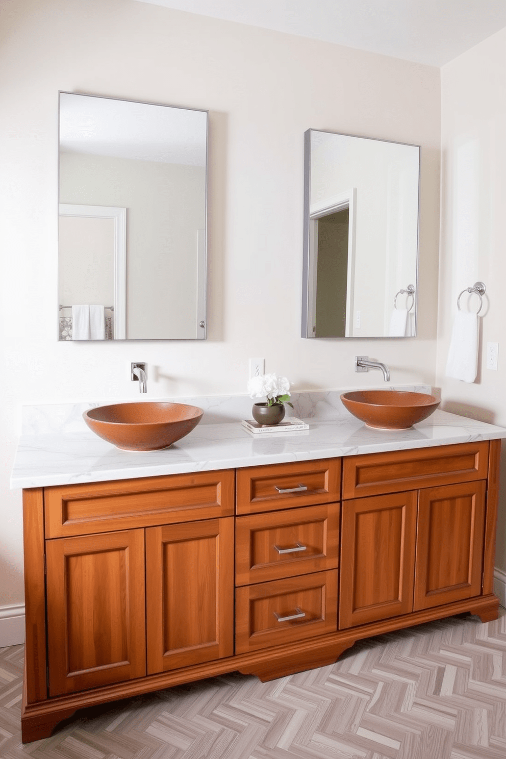 A double vanity with stylish vessel sinks is the centerpiece of this transitional bathroom. The cabinetry features a blend of classic and modern elements, with a warm wood finish that complements the elegant marble countertop. Above the sinks, sleek frameless mirrors reflect the soft lighting, enhancing the spacious feel of the room. The walls are adorned in a soft neutral tone, while the floor showcases a beautiful herringbone pattern in light and dark tiles.