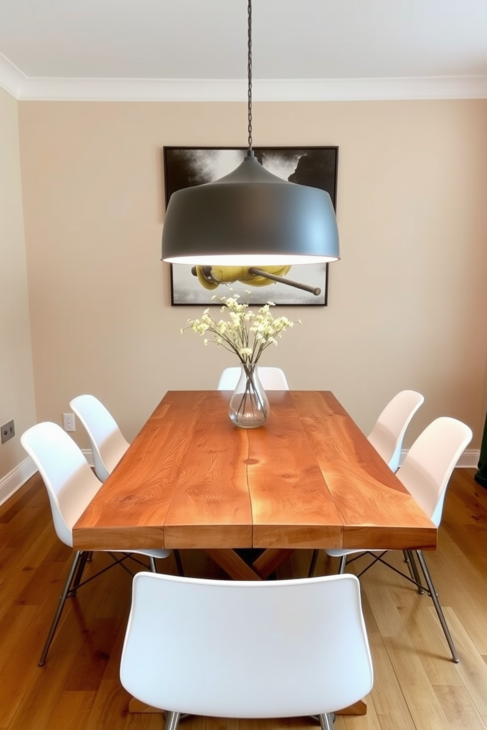 A charming farmhouse table made of reclaimed wood serves as the centerpiece of the dining room. Surrounding the table are sleek modern chairs with clean lines and a minimalist design, creating a striking contrast. The walls are painted in a soft beige, enhancing the warmth of the wood. A large pendant light hangs above the table, illuminating the space with a warm glow.