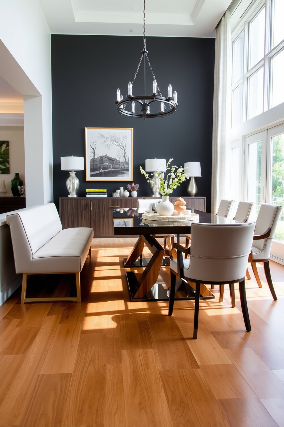 A sleek dining bench is placed against a wall in a transitional dining room, featuring soft upholstery in a neutral tone. The table is a blend of modern and traditional styles, surrounded by elegant chairs that complement the overall aesthetic. Natural light floods the space through large windows, highlighting the warm wooden tones of the flooring. Decorative elements, such as a statement chandelier and tasteful artwork, enhance the inviting atmosphere of the room.