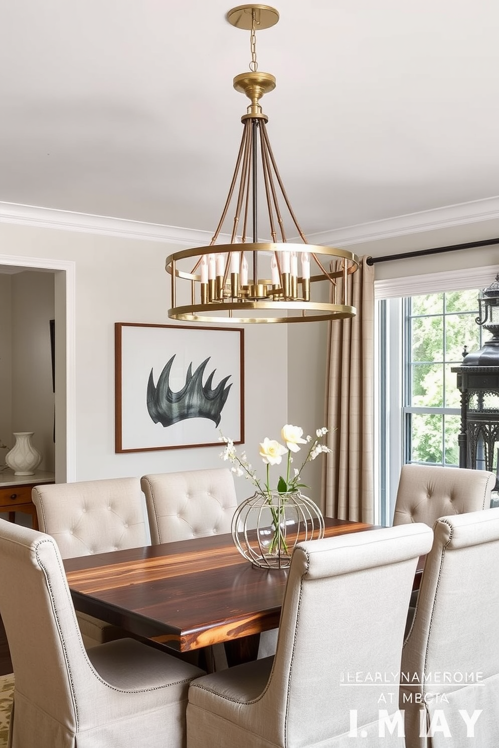 A transitional dining room features a blend of modern and traditional elements. The light fixtures incorporate both brushed nickel and antique brass finishes, creating a harmonious mix of metals. The dining table is a reclaimed wood piece paired with upholstered chairs in a soft neutral fabric. A statement chandelier above the table showcases the unique combination of metal finishes, illuminating the space beautifully.