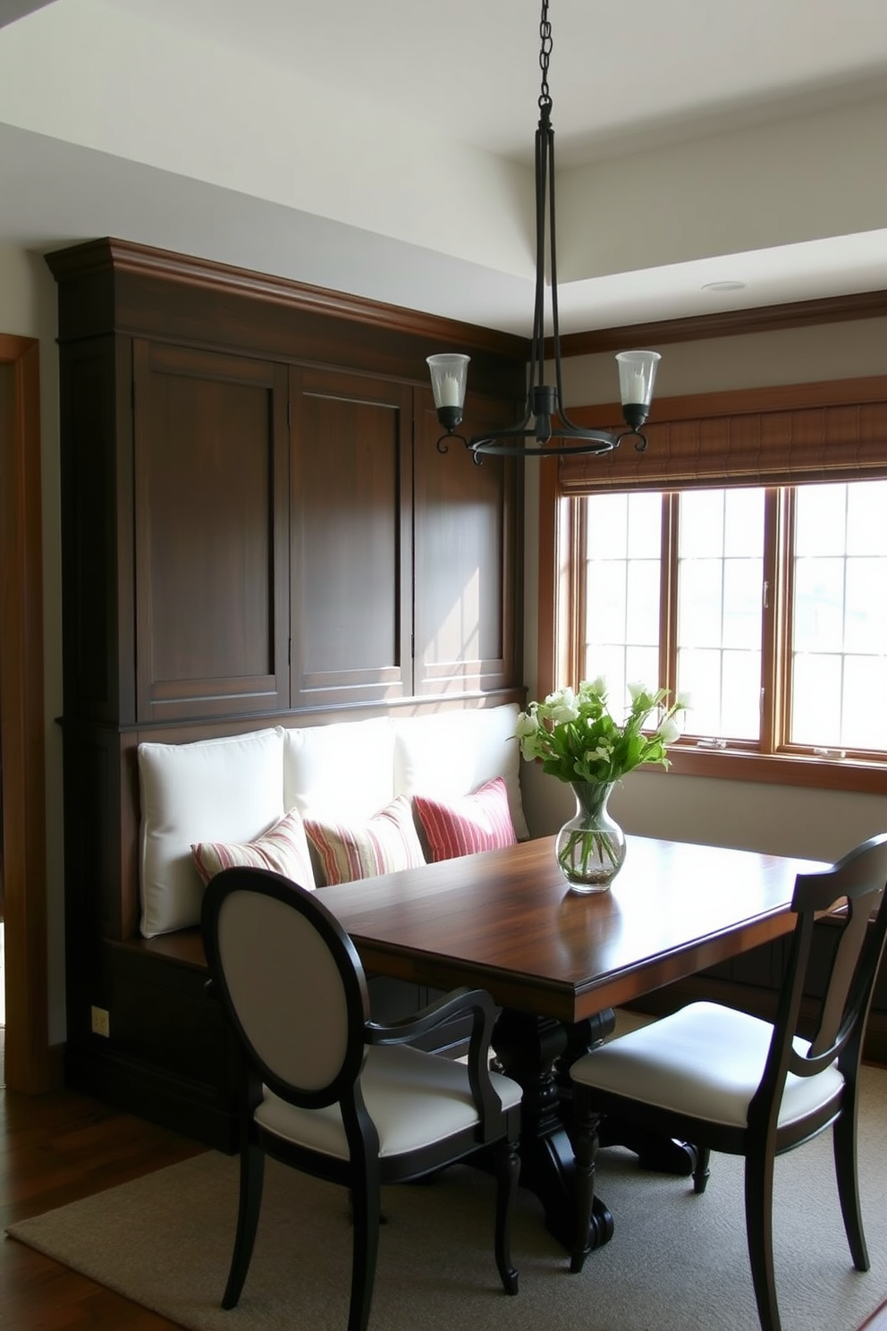 A cozy dining room featuring a built-in bench adorned with plush cushions for added comfort. The bench is positioned against a large window, allowing natural light to fill the space, complemented by a rustic wooden dining table surrounded by elegant chairs.