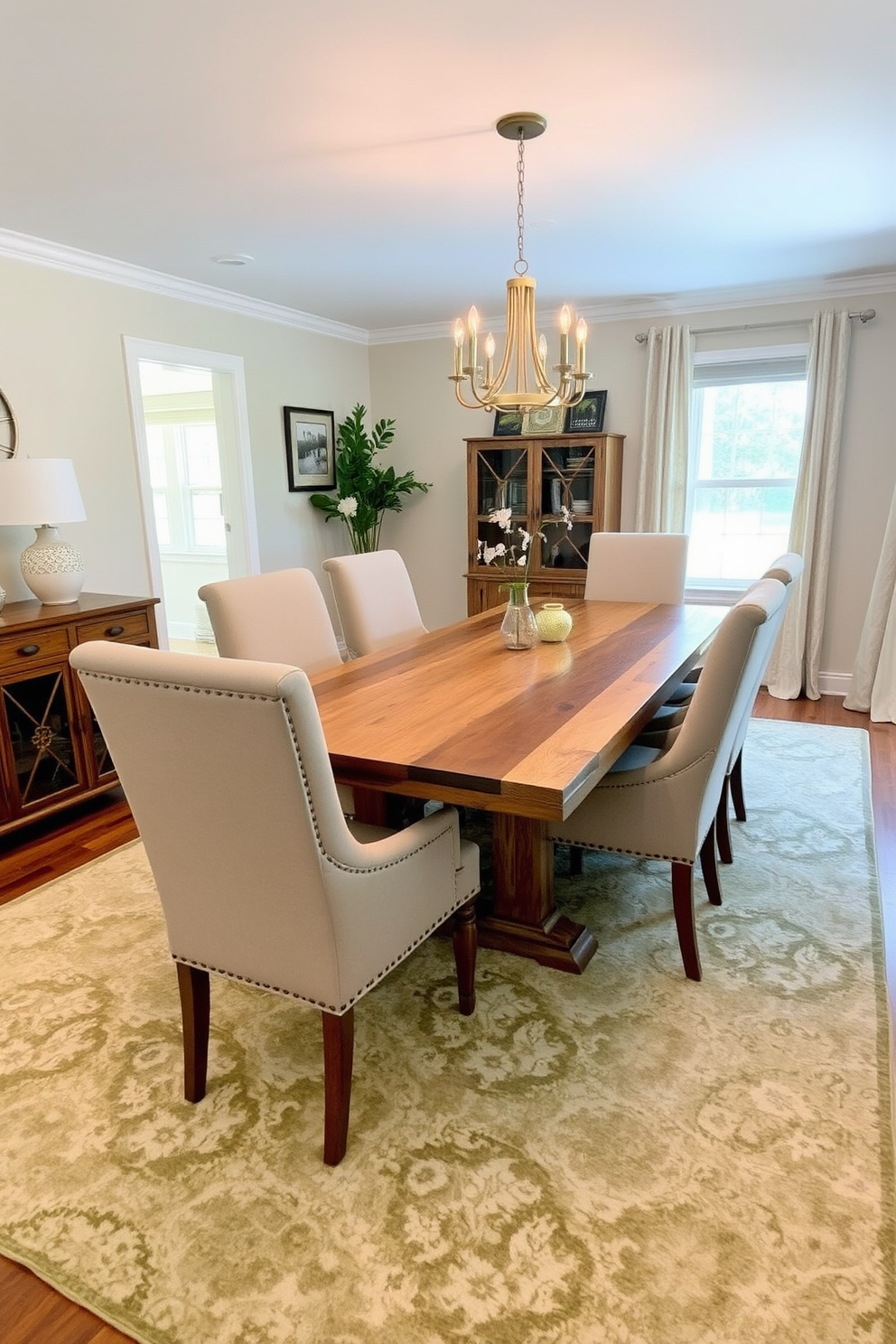 A large area rug anchors the dining space, featuring a blend of soft neutrals and subtle patterns that complement the surrounding decor. The dining table is a beautiful reclaimed wood piece surrounded by upholstered chairs in a contrasting fabric, creating a warm and inviting atmosphere.