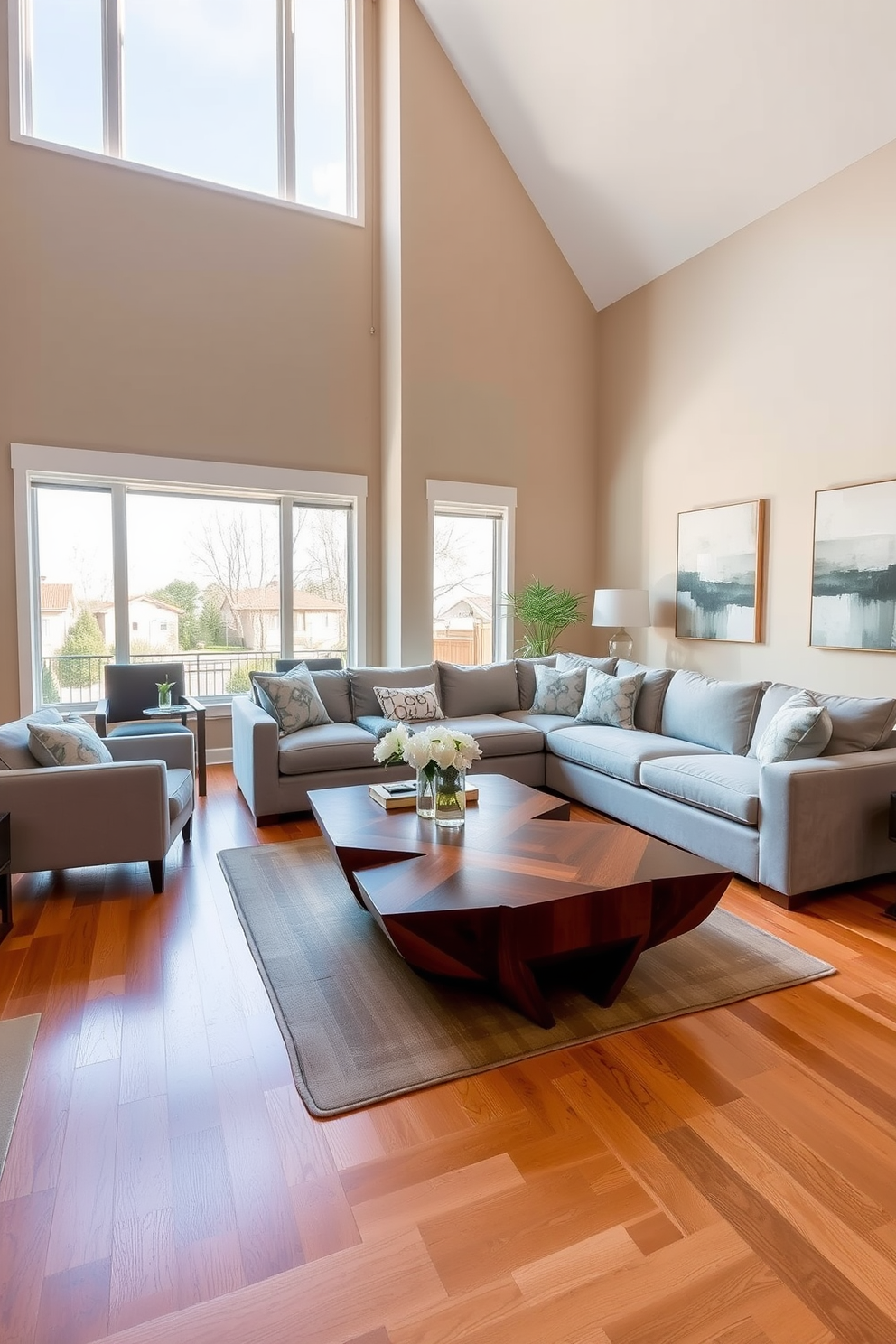 A stylish transitional living room featuring a statement coffee table as the focal point. The coffee table is a unique geometric design in rich wood, surrounded by a plush sectional sofa upholstered in soft gray fabric. Floor-to-ceiling windows allow natural light to flood the space, highlighting the warm tones of the hardwood flooring. The walls are painted in a soft beige, adorned with abstract art that complements the room's color palette.