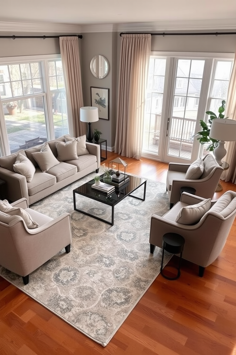 A cozy transitional living room featuring a plush sectional sofa adorned with soft throw pillows in muted tones. A large area rug anchors the space, complementing the warm wood flooring and adding a layer of comfort. Natural light floods the room through expansive windows, framed by elegant drapes that softly cascade to the floor. A stylish coffee table sits at the center, surrounded by accent chairs that invite relaxation and conversation.