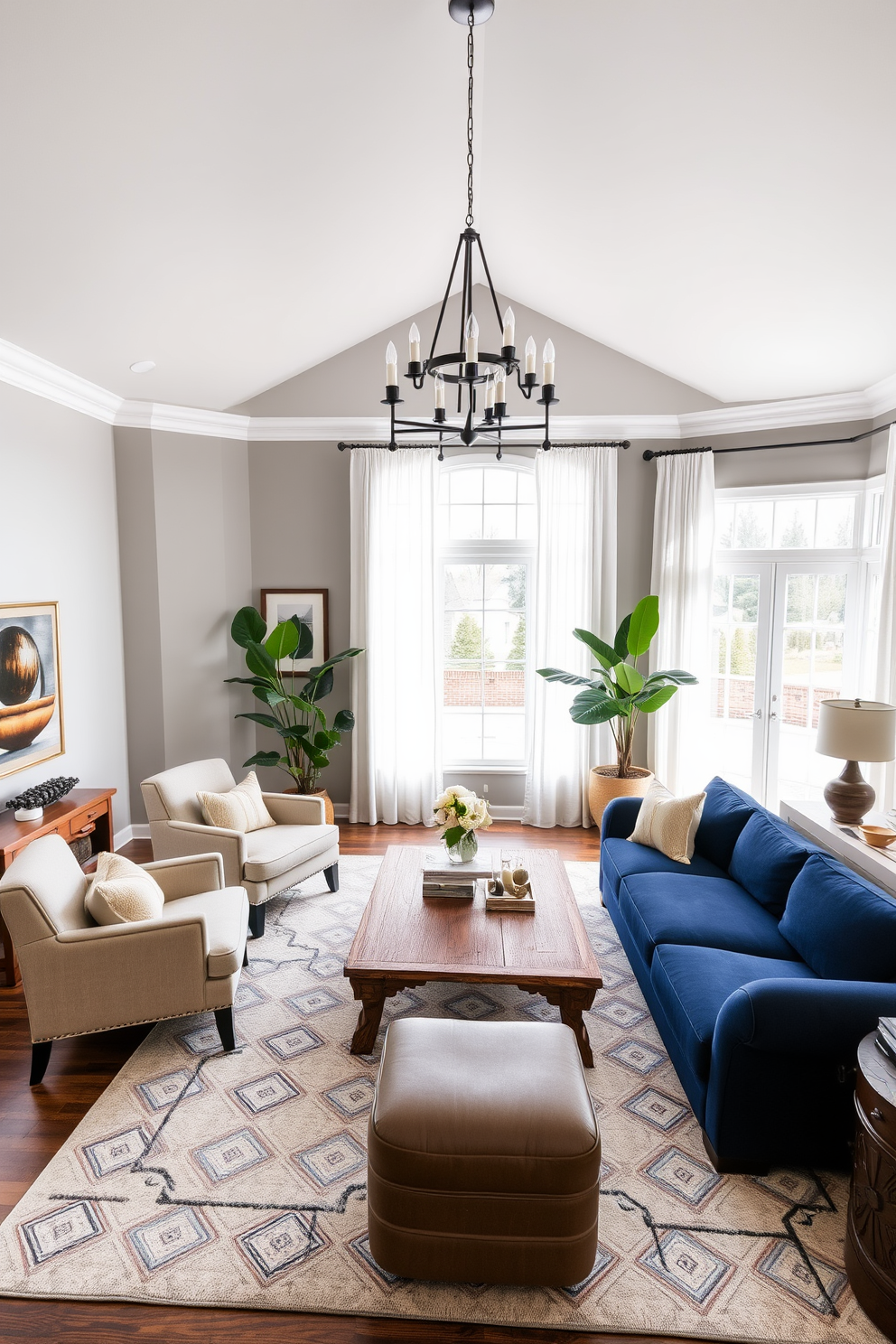 A transitional living room that harmoniously blends traditional and contemporary elements. The walls are painted in a soft gray, while the furniture features a mix of deep navy and warm beige tones. A large sectional sofa in a rich navy fabric is complemented by a pair of beige accent chairs with elegant armrests. A reclaimed wood coffee table sits at the center, surrounded by a plush area rug in a geometric pattern that ties the colors together. Floor-to-ceiling windows allow natural light to flood the room, adorned with sheer white curtains that soften the light. A statement chandelier with a modern design hangs above, creating a focal point in the space. Decorative elements include a mix of framed artwork and a large potted plant in one corner, adding life and texture to the room. The overall design creates a welcoming atmosphere that balances comfort and sophistication.