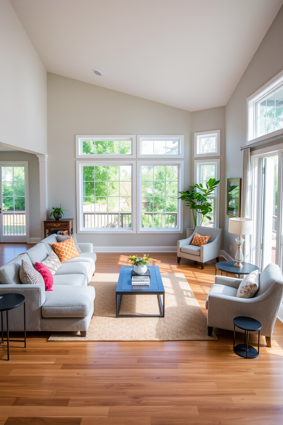 A functional open layout design featuring a spacious transitional living room. The room includes a comfortable sectional sofa in soft gray, accented with colorful throw pillows and a stylish coffee table in the center. Large windows allow natural light to flood the space, enhancing the warm wood tones of the flooring. A cozy reading nook is created in one corner with a plush armchair and a small side table, inviting relaxation.