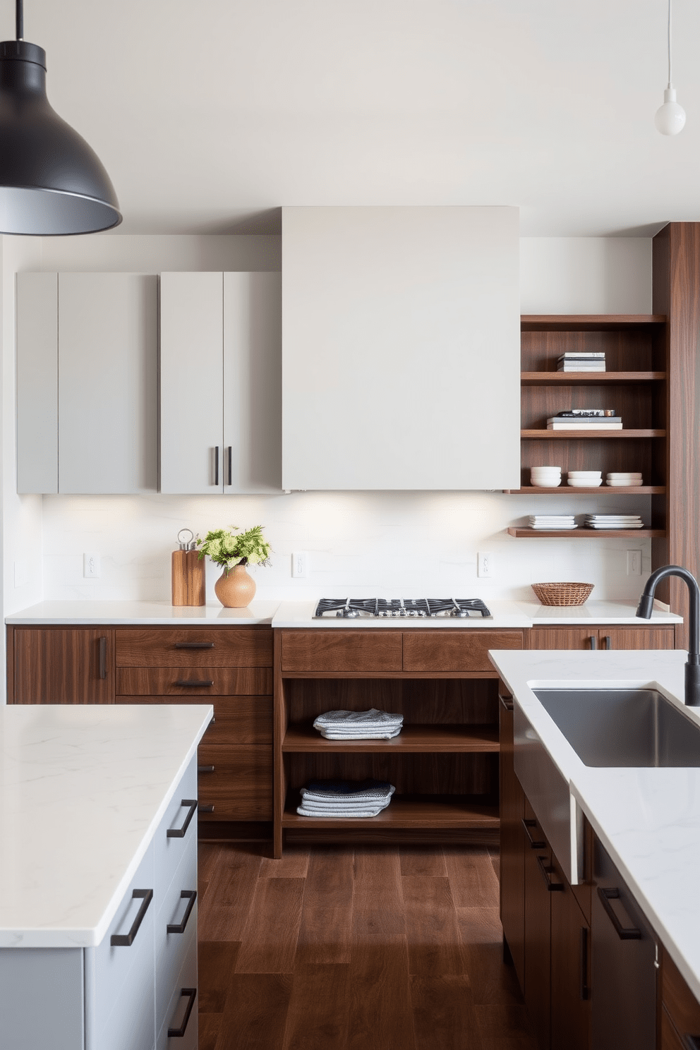 A light gray kitchen with dark wood accents creates a modern yet warm atmosphere. The cabinetry features sleek light gray fronts, complemented by rich dark wood for the island and open shelving. The countertops are a polished white stone that enhances the overall brightness of the space. Pendant lights with a matte black finish hang above the island, adding a touch of elegance.