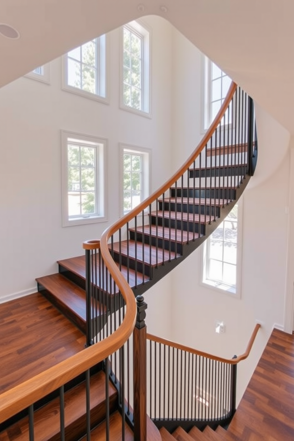 A modern U-shaped staircase features a sleek wooden handrail and metal balusters that create a striking contrast. The treads are made of rich hardwood, while the risers are finished in a matte black for a contemporary look. Natural light floods the space through large windows, highlighting the elegant curves of the staircase. The surrounding walls are painted in a soft white, enhancing the staircase's bold design.