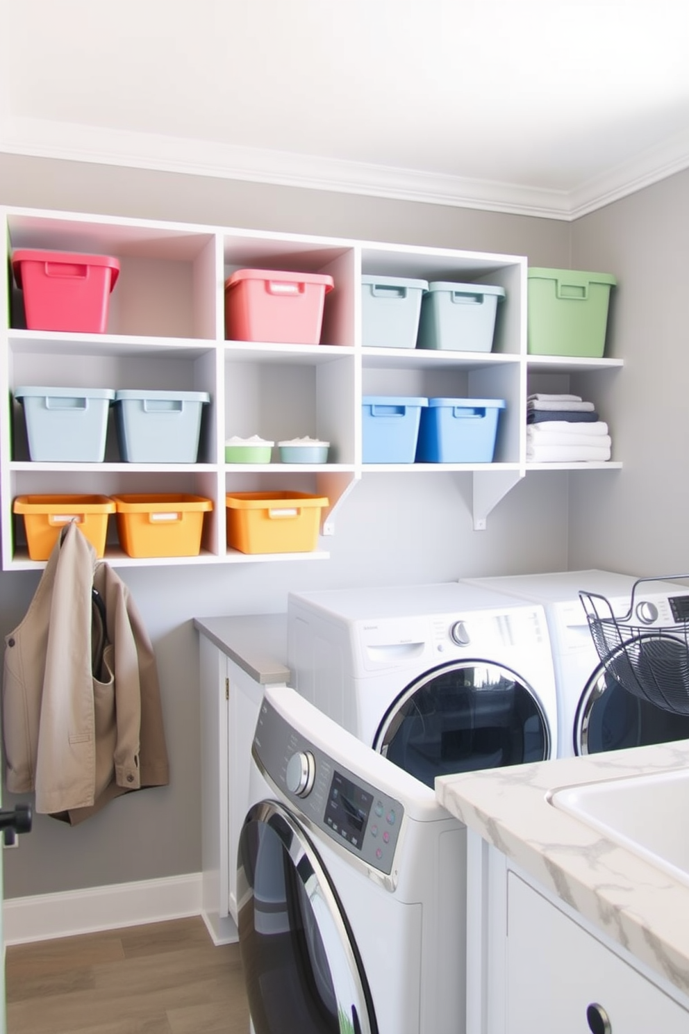 A utility room laundry room combo features color-coordinated storage bins neatly arranged on open shelves. The walls are painted in a soft gray tone, and a stylish countertop provides space for folding laundry.