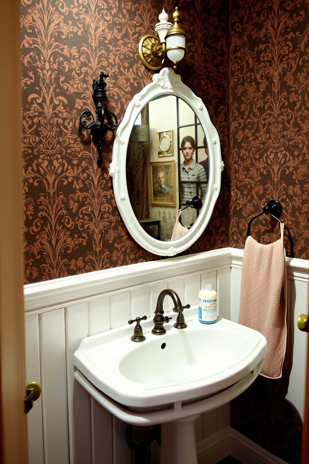 A charming Victorian powder room featuring vintage hooks elegantly mounted on the wall for stylish towel hanging. The space is adorned with intricate wallpaper in rich colors, and a classic pedestal sink complements the overall aesthetic.