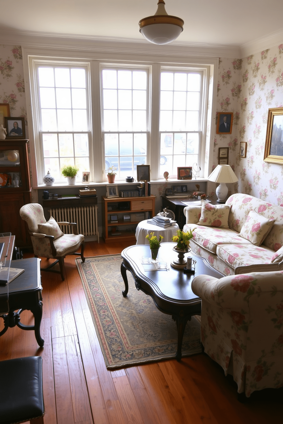 A vintage apartment filled with character and charm. The living room features floral print upholstery on a plush sofa, complemented by an antique coffee table and a patterned area rug. The walls are adorned with vintage wallpaper showcasing delicate floral motifs. Large windows allow natural light to flood the space, highlighting the rich wood flooring and eclectic decor.