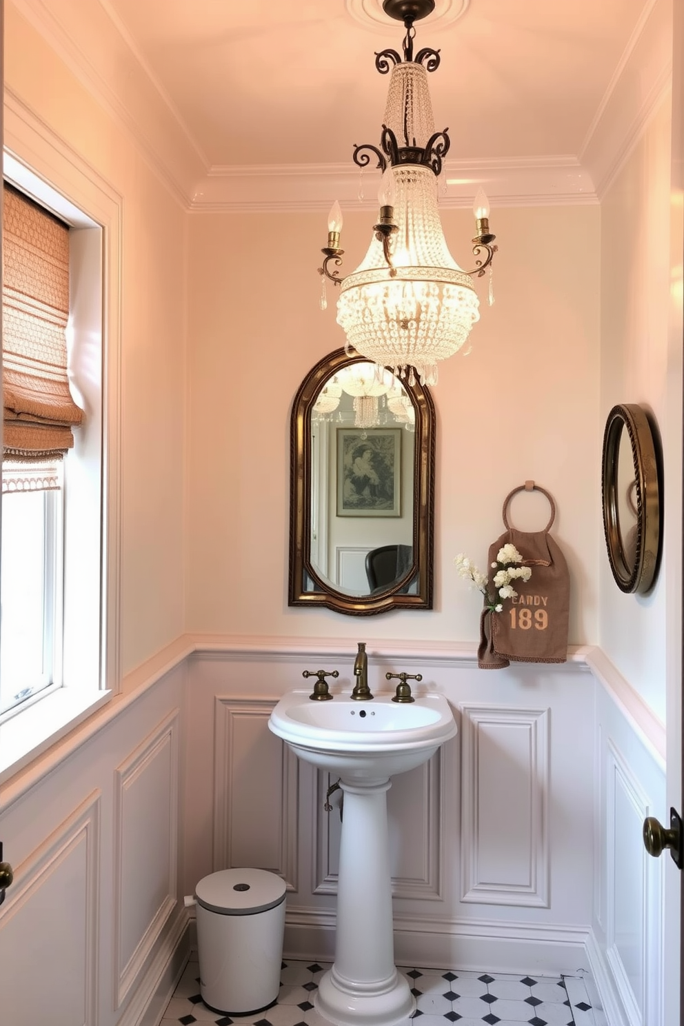 A vintage powder room adorned with soft lighting creates a warm and inviting atmosphere. The focal point is a stunning vintage chandelier that hangs gracefully from the ceiling, casting a soft glow throughout the space. The walls are painted in a delicate pastel hue, complemented by intricate wainscoting that adds depth and character. A charming pedestal sink with antique brass fixtures sits against one wall, surrounded by tasteful decor that enhances the vintage aesthetic.