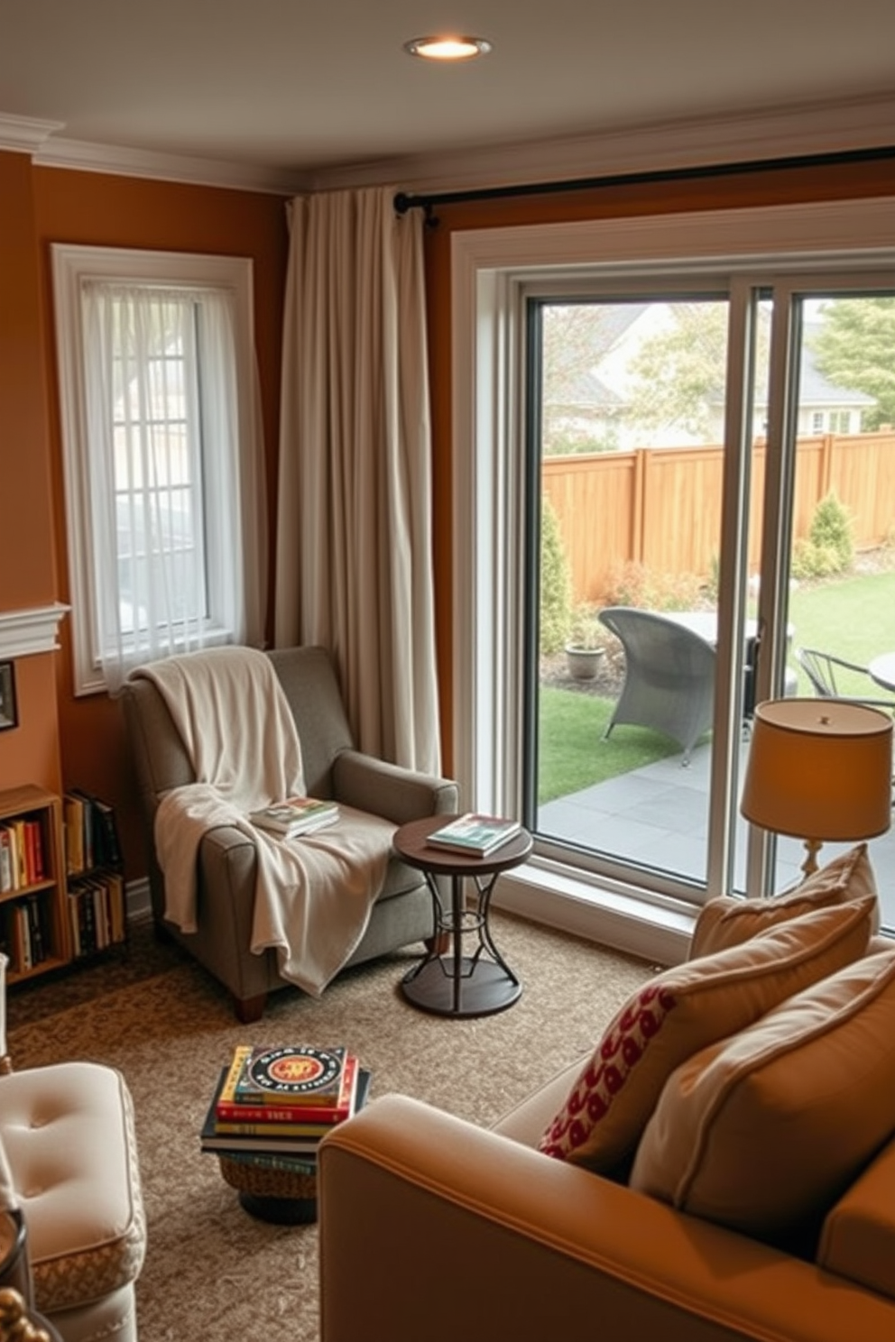 Cozy reading nook by the window. A plush armchair is positioned in the corner, draped with a soft blanket, next to a small wooden side table holding a stack of books and a steaming cup of tea. The walls are painted in warm, inviting tones, and sheer curtains allow soft natural light to filter in. A small bookshelf is nestled beside the chair, filled with colorful novels and a few decorative items to enhance the cozy atmosphere. Walkout Basement Design Ideas. The space features large sliding glass doors that open to a beautifully landscaped backyard, allowing ample natural light to flood in. Comfortable seating arrangements are created with a sectional sofa and a couple of accent chairs, complemented by a stylish coffee table. Soft area rugs and warm lighting fixtures add to the inviting ambiance of the basement.