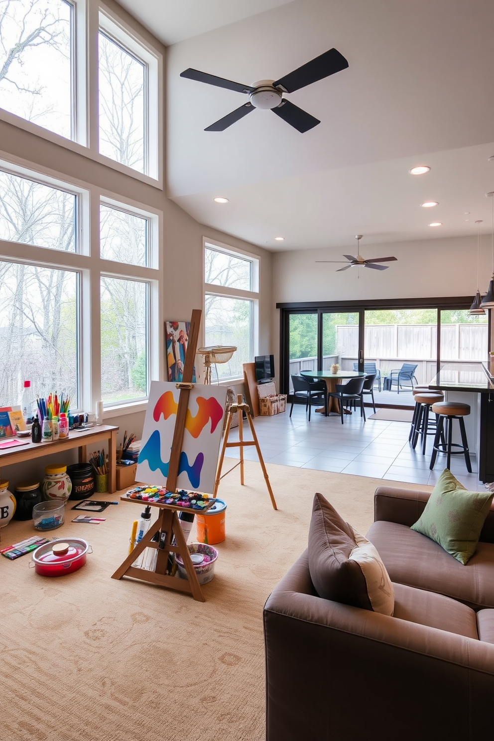 An art studio with large windows showcasing inspiring views of nature. The space features an easel in the center, surrounded by vibrant paint supplies and a cozy seating area for relaxation. A walkout basement designed for entertainment and comfort. It includes a spacious lounge area with plush seating, a bar with stylish stools, and sliding glass doors leading to an outdoor patio.