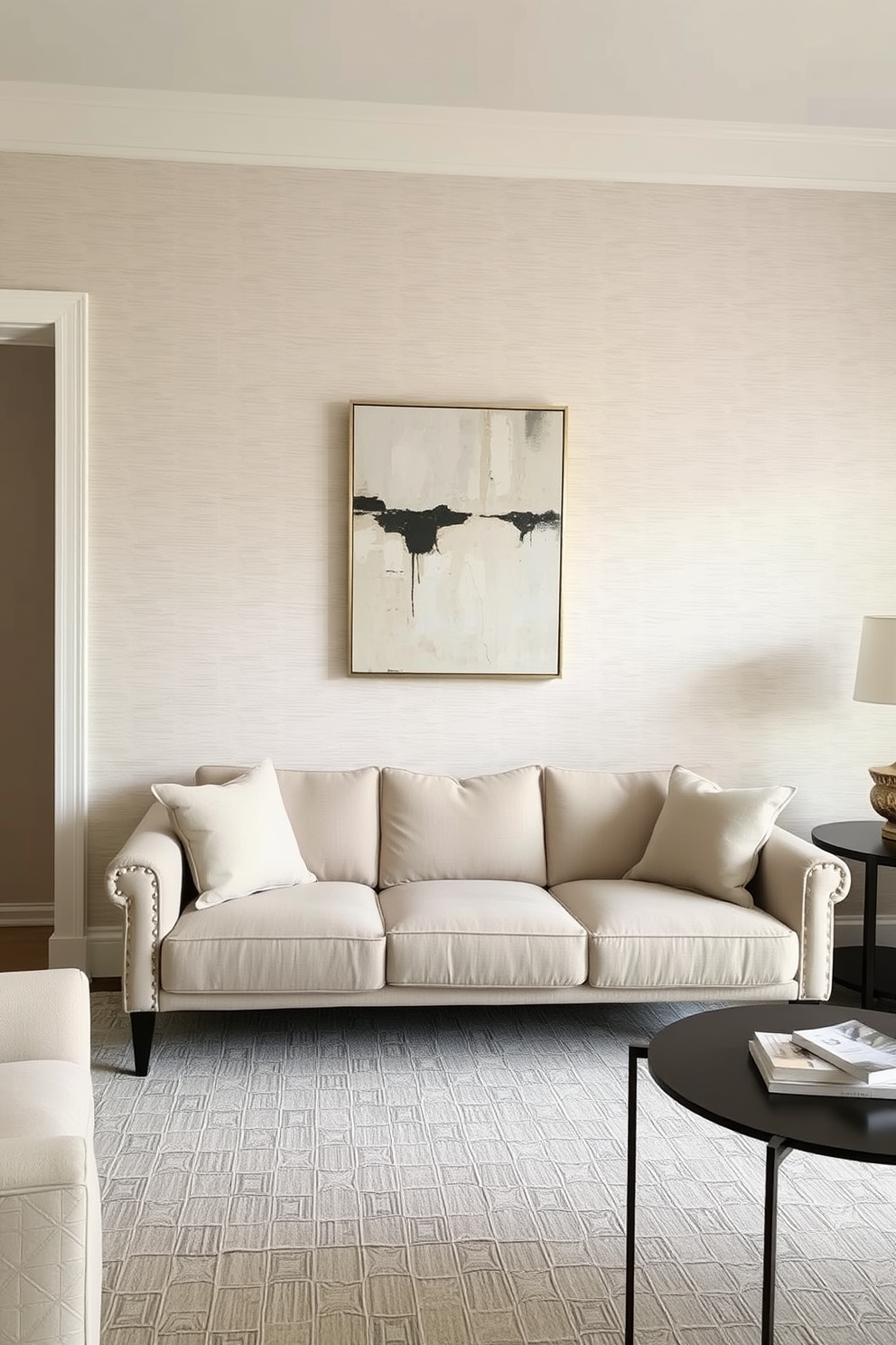 A living room adorned with textured wallpaper that adds depth and character to the space. The wallpaper features a subtle geometric pattern in soft neutral tones, creating a warm and inviting atmosphere. The walls are painted in a complementary light gray shade that enhances the room's natural light. A statement piece of abstract art hangs above the plush sofa, tying together the room's color palette and design elements.