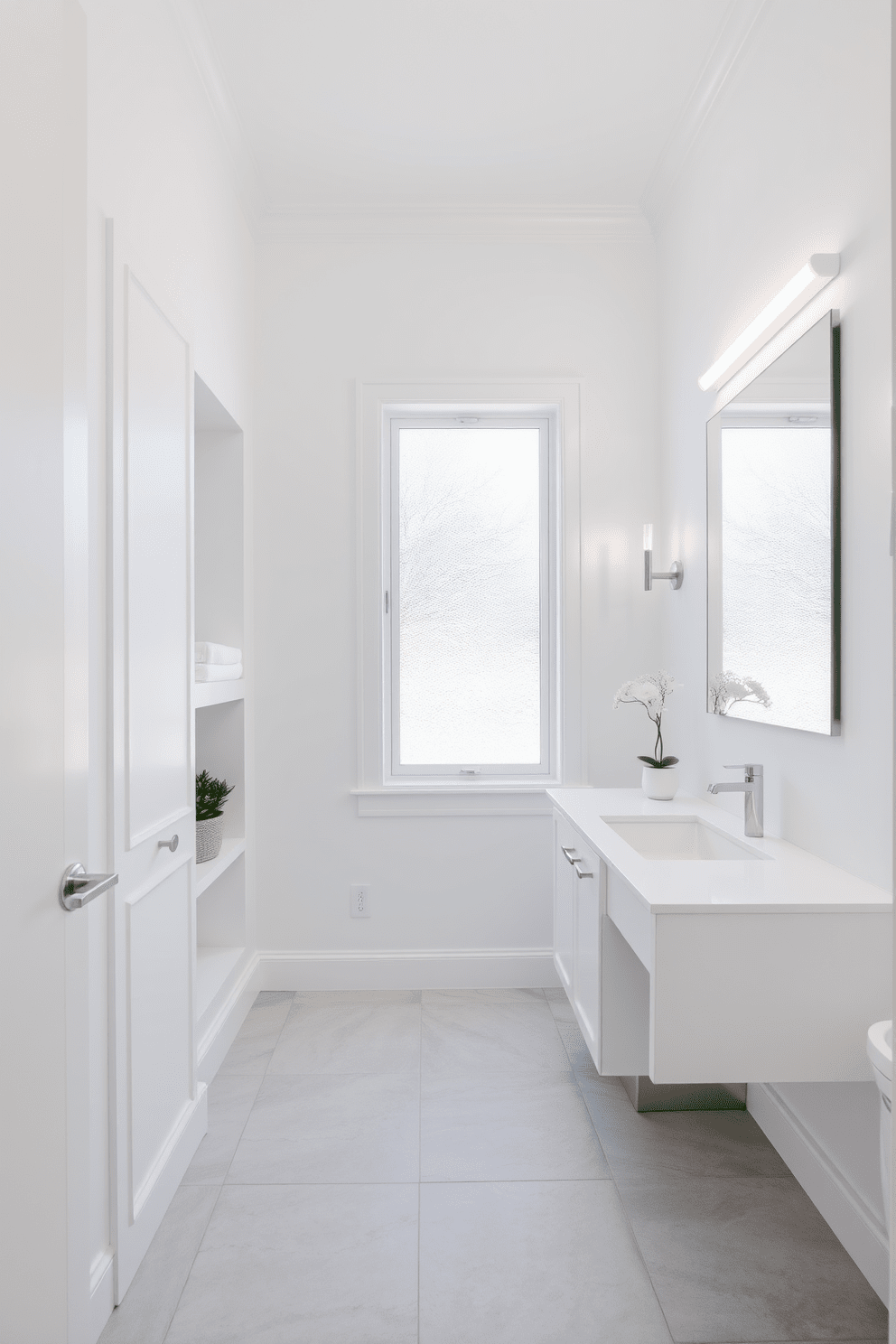 A bright and airy bathroom featuring built-in niches designed for storing toiletries and displaying decor. The walls are painted in a crisp white, complemented by sleek white cabinetry and a large frameless mirror that enhances the spacious feel. The floor is adorned with large light gray tiles, creating a subtle contrast with the white fixtures. Soft, natural light streams in through a frosted window, illuminating a decorative plant placed on one of the niches.