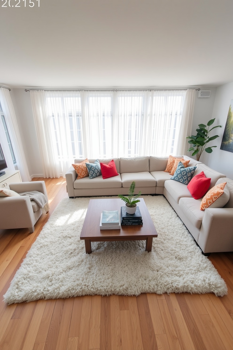 A soft white area rug is placed in the center of a spacious family room, creating a cozy and inviting atmosphere. Surrounding the rug, a plush sectional sofa in light gray offers ample seating, adorned with colorful throw pillows for a pop of color. Natural light floods the room through large windows dressed in sheer white curtains, enhancing the airy feel. A wooden coffee table sits at the center, topped with decorative books and a small potted plant, adding a touch of greenery to the space.