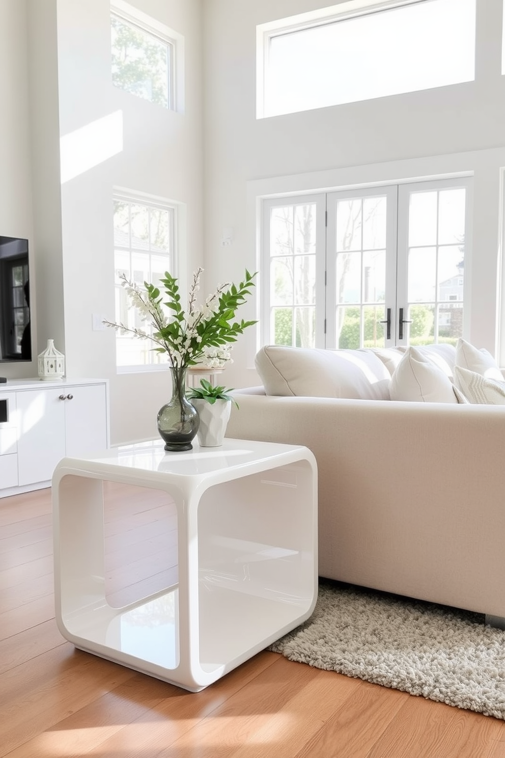 A stylish white side table stands elegantly beside a plush sectional sofa in a bright family room. The table features a sleek design with clean lines and a glossy finish, complementing the airy atmosphere of the space. In this family room design, large windows allow natural light to flood in, highlighting the soft neutral tones of the decor. A cozy area rug anchors the seating arrangement, while decorative accents on the side tables add a touch of personality.