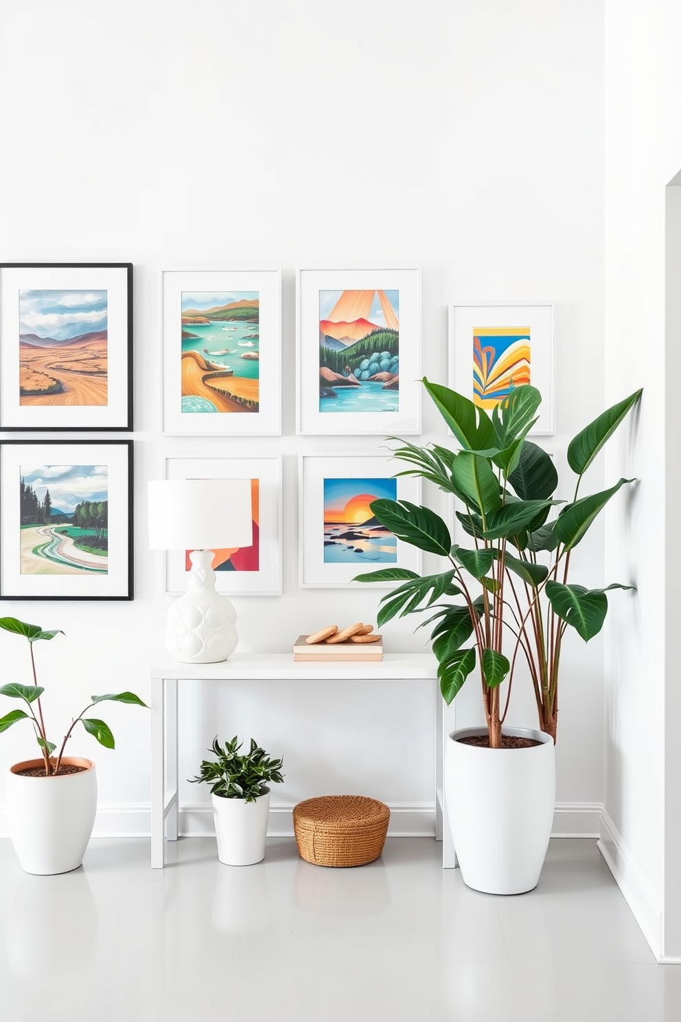 Bright artwork against white walls. The gallery-style display features a mix of abstract and landscape pieces in vibrant colors, creating a striking contrast with the clean, bright backdrop. White foyer design ideas. The space includes a sleek console table with a minimalist design, flanked by oversized potted plants that add a touch of greenery and warmth to the airy environment.