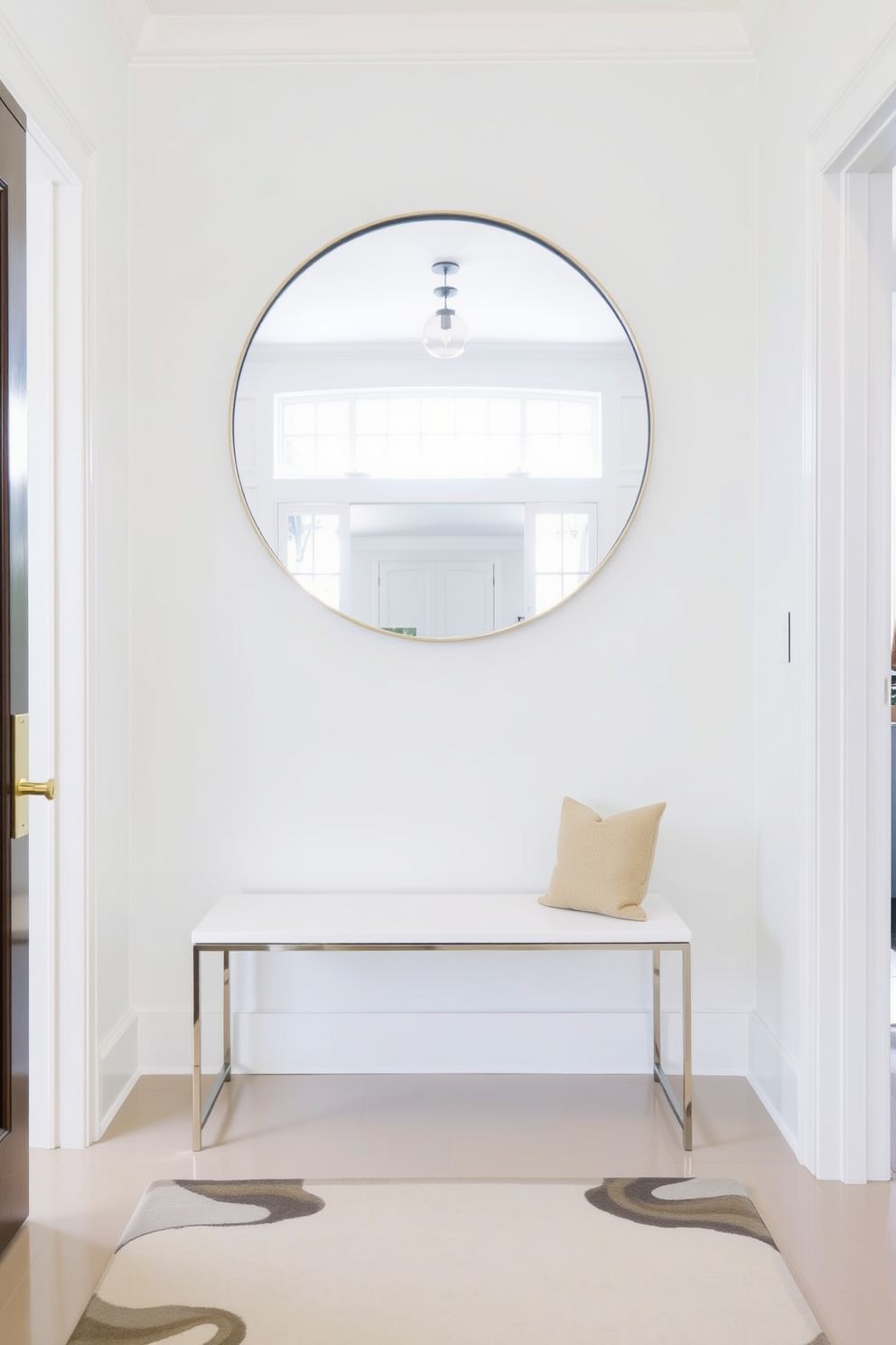 A bright and airy foyer features a large round mirror hanging above a sleek white bench. The walls are painted in a soft pastel color, and a stylish rug lays at the entrance, welcoming guests into the space.