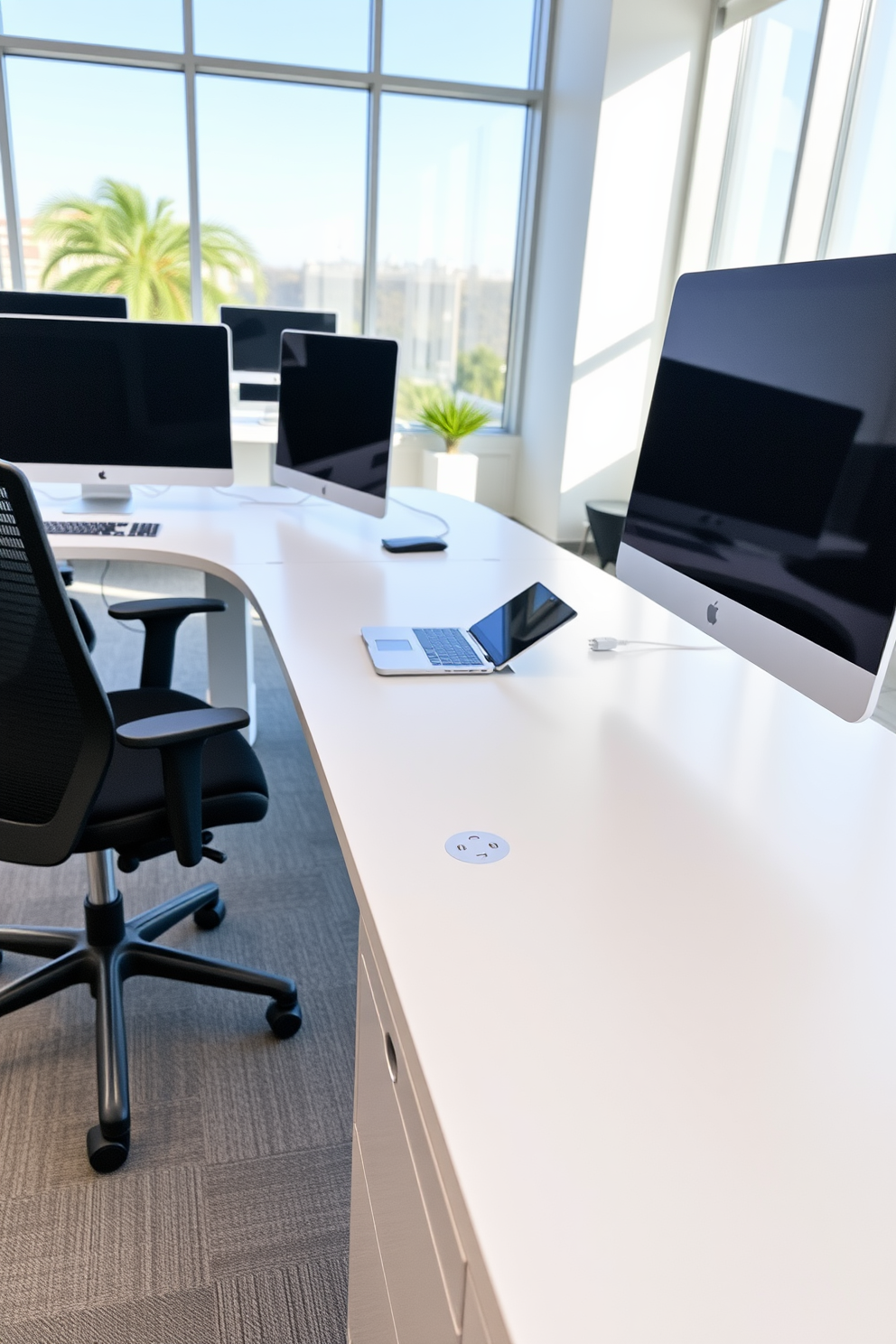 A sleek white desk features integrated power outlets for seamless connectivity. The office is designed with minimalistic furniture and bright natural light streaming through large windows.