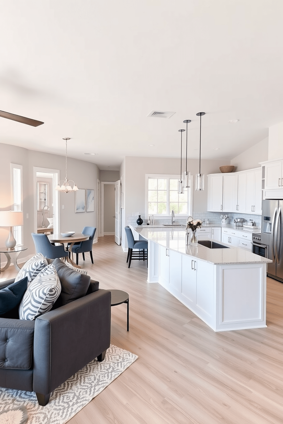 Open concept layout for easy entertaining featuring a spacious living area seamlessly connected to a modern white kitchen. The kitchen boasts sleek cabinetry, an oversized island with bar seating, and stainless steel appliances, creating an inviting space for gatherings.