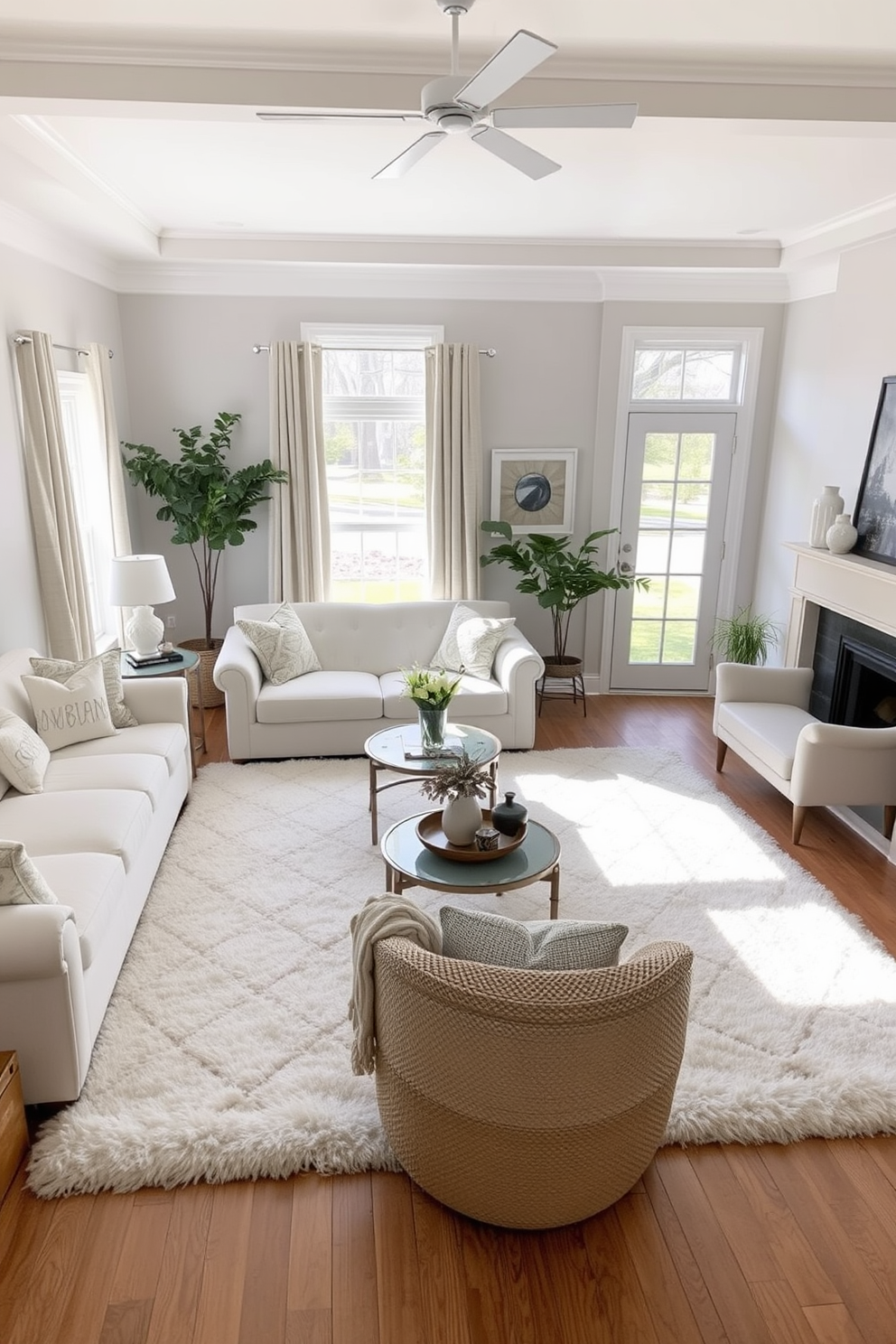 A bright and airy living room features a soft white area rug that adds warmth and comfort to the space. The room is adorned with plush white sofas and accent chairs, creating an inviting atmosphere perfect for relaxation and gatherings.