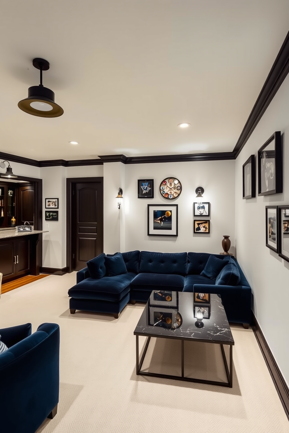 Bright white walls with dark trim create a striking contrast that enhances the overall aesthetic of the space. The room features a plush sectional sofa in deep navy, complemented by a sleek black coffee table and industrial-style lighting fixtures. In one corner, a custom-built bar area showcases dark wood cabinetry and a polished granite countertop. Framed sports memorabilia adorns the walls, adding a personal touch and creating a vibrant atmosphere for entertainment.