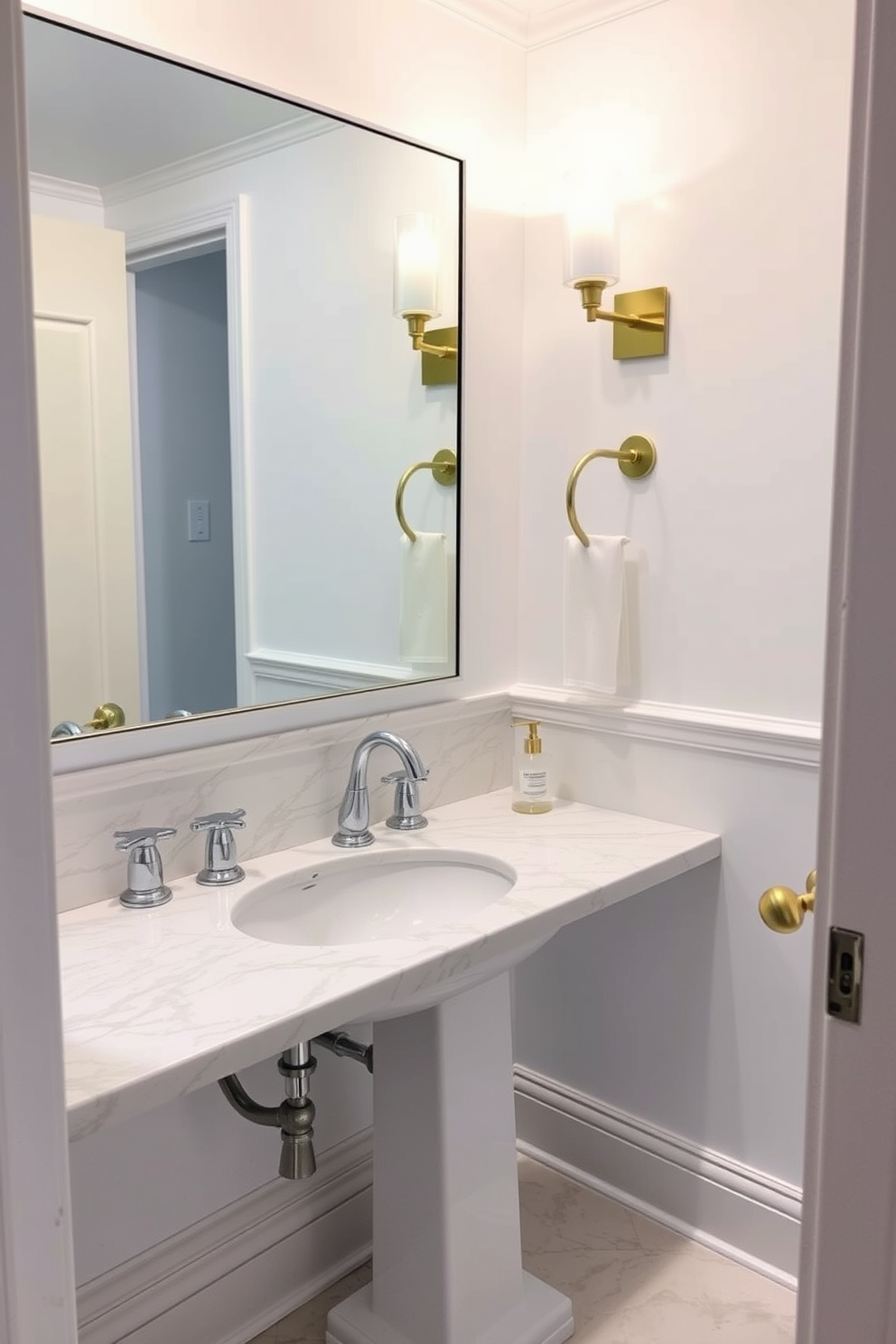 A chic powder room adorned with a stunning marble countertop featuring polished chrome fixtures. The walls are painted in a crisp white, creating a clean and airy atmosphere that enhances the elegance of the space. A sleek pedestal sink complements the marble, providing a minimalist touch. Accents of gold in the light fixtures and accessories add a touch of luxury to this refined powder room design.