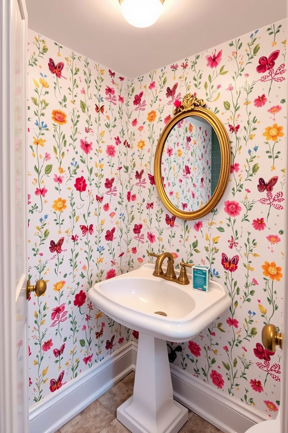 A whimsical wallpaper design featuring colorful patterns of flowers and butterflies adorns the walls, creating a playful and inviting atmosphere. The white powder room is accented with a vintage-style pedestal sink and a round mirror framed in soft gold, adding a touch of elegance to the cheerful space.