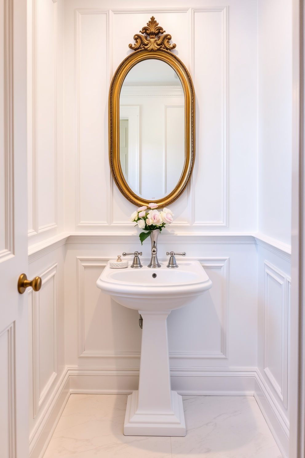 Classic wainscoting adorns the walls of a refined powder room, creating a sense of timeless elegance. The space features a sleek pedestal sink with a polished chrome faucet and a large round mirror framed in antique gold. Soft lighting illuminates the room, highlighting the intricate details of the wainscoting and the subtle texture of the soft white paint. A luxurious white marble floor adds sophistication, while a delicate floral arrangement sits on the sink for a touch of freshness.