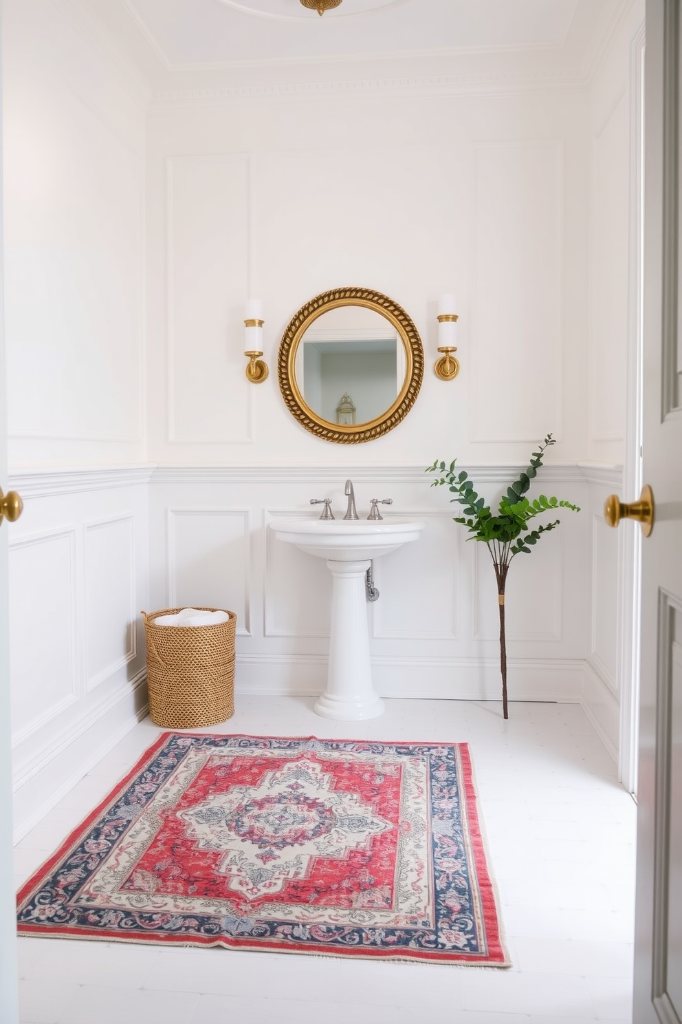 A charming white powder room featuring a vintage rug that adds warmth and color to the space. The walls are adorned with elegant wainscoting, and the floor is tiled with classic white ceramic tiles. A stylish pedestal sink sits against one wall, complemented by a round mirror with a decorative frame above it. Soft ambient lighting illuminates the room, creating a welcoming atmosphere.