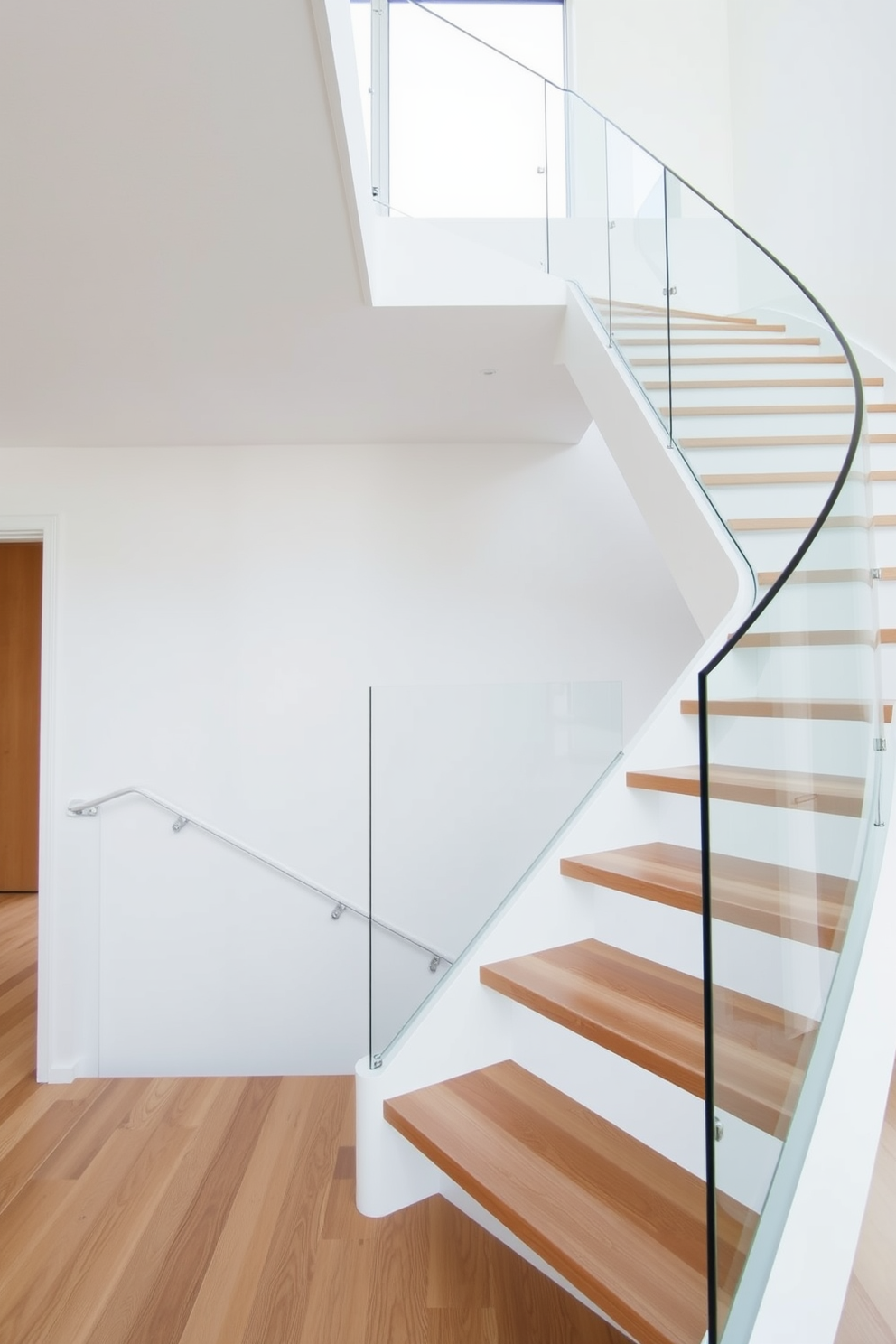 Open riser white staircase with sleek lines and a minimalist design. The staircase features wide wooden treads and a glass railing that enhances the airy atmosphere of the space.