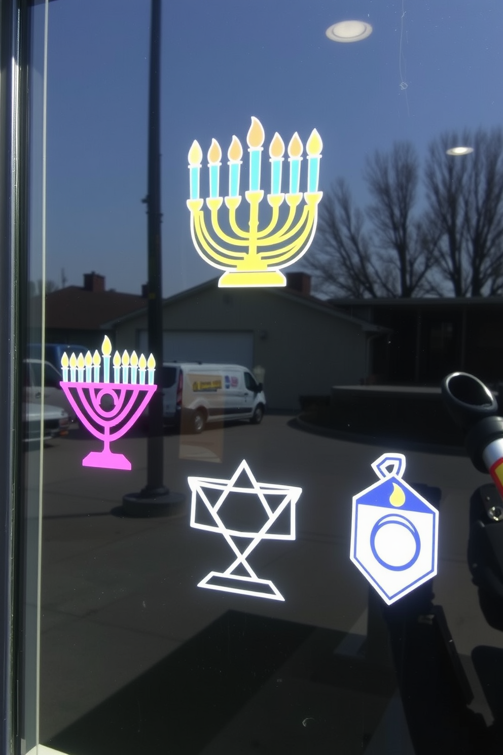 Creative window decals featuring colorful menorahs and playful dreidels adorn the glass panes. The vibrant designs celebrate the spirit of Hanukkah, adding festive charm to any window display.