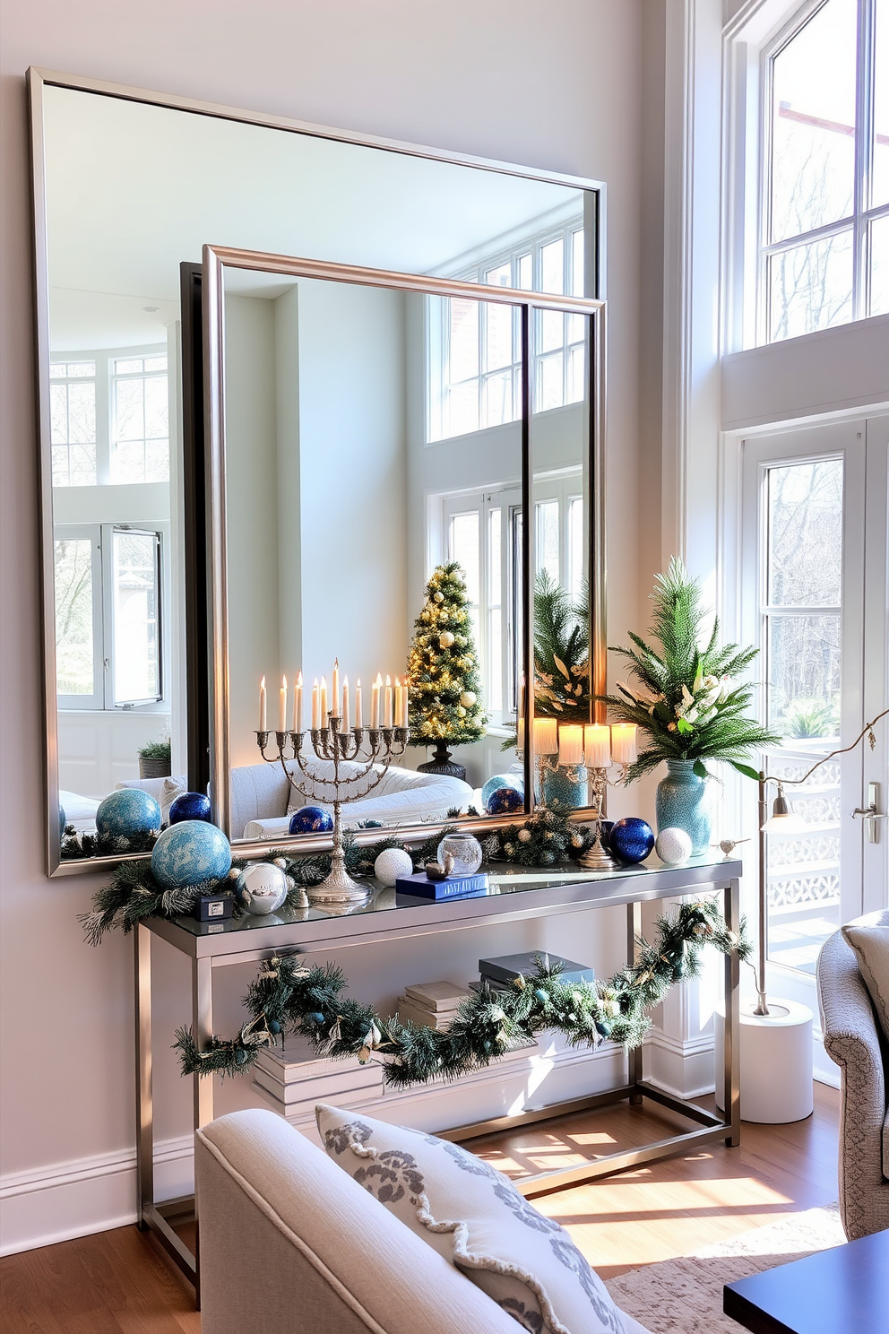 A bright and airy living room features an oversized mirror that reflects natural light coming through large windows. The mirror is framed in a sleek metallic finish and positioned above a stylish console table adorned with seasonal decorations. For Hanukkah, the window displays are adorned with elegant blue and silver accents. Decorative menorahs, along with string lights and festive garlands, create a warm and inviting atmosphere that celebrates the holiday spirit.