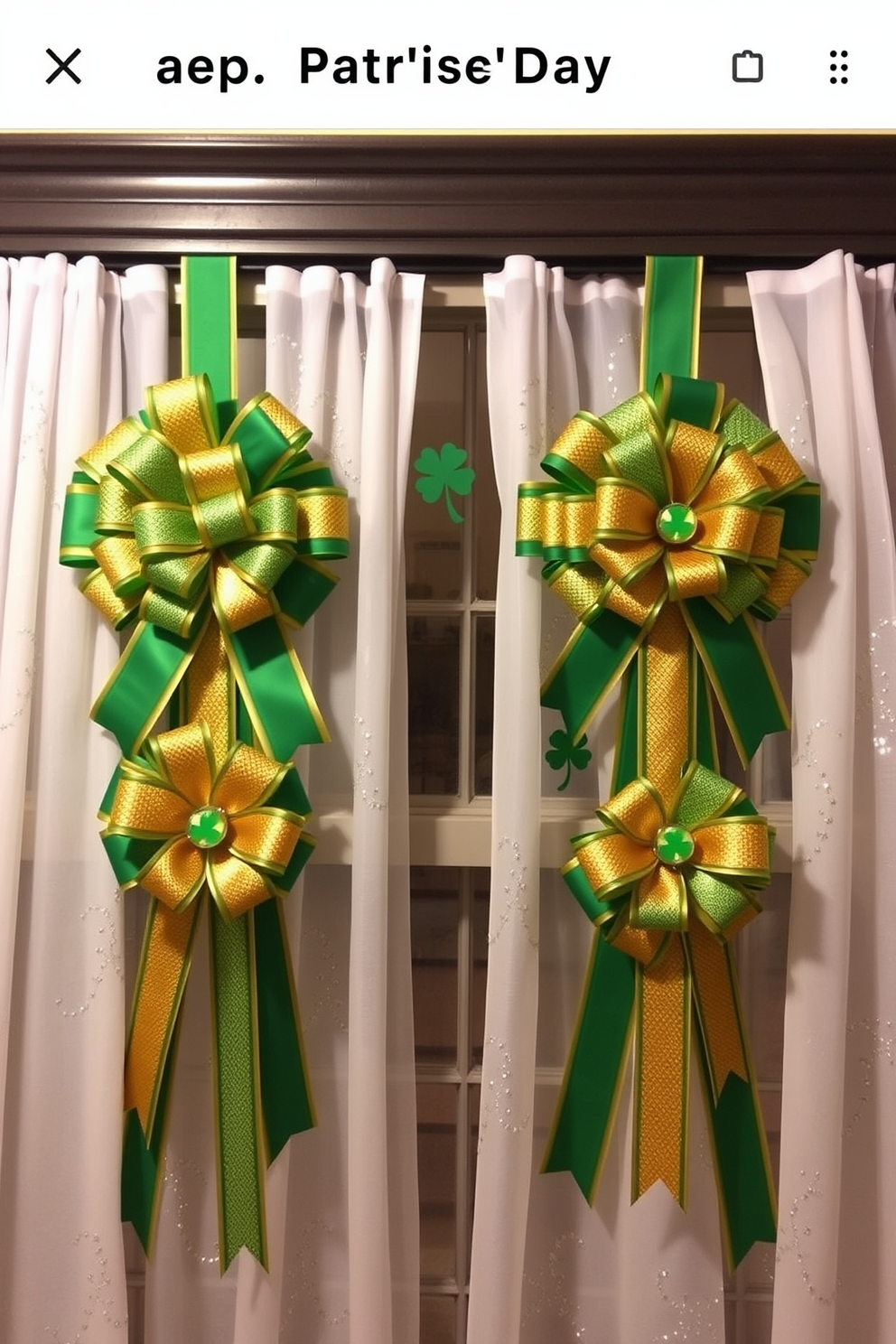 A festive St. Patrick's Day decoration featuring green and gold ribbon bows tied elegantly around a large window. The bows are complemented by delicate shamrock accents and sheer white curtains, creating a cheerful and inviting atmosphere.