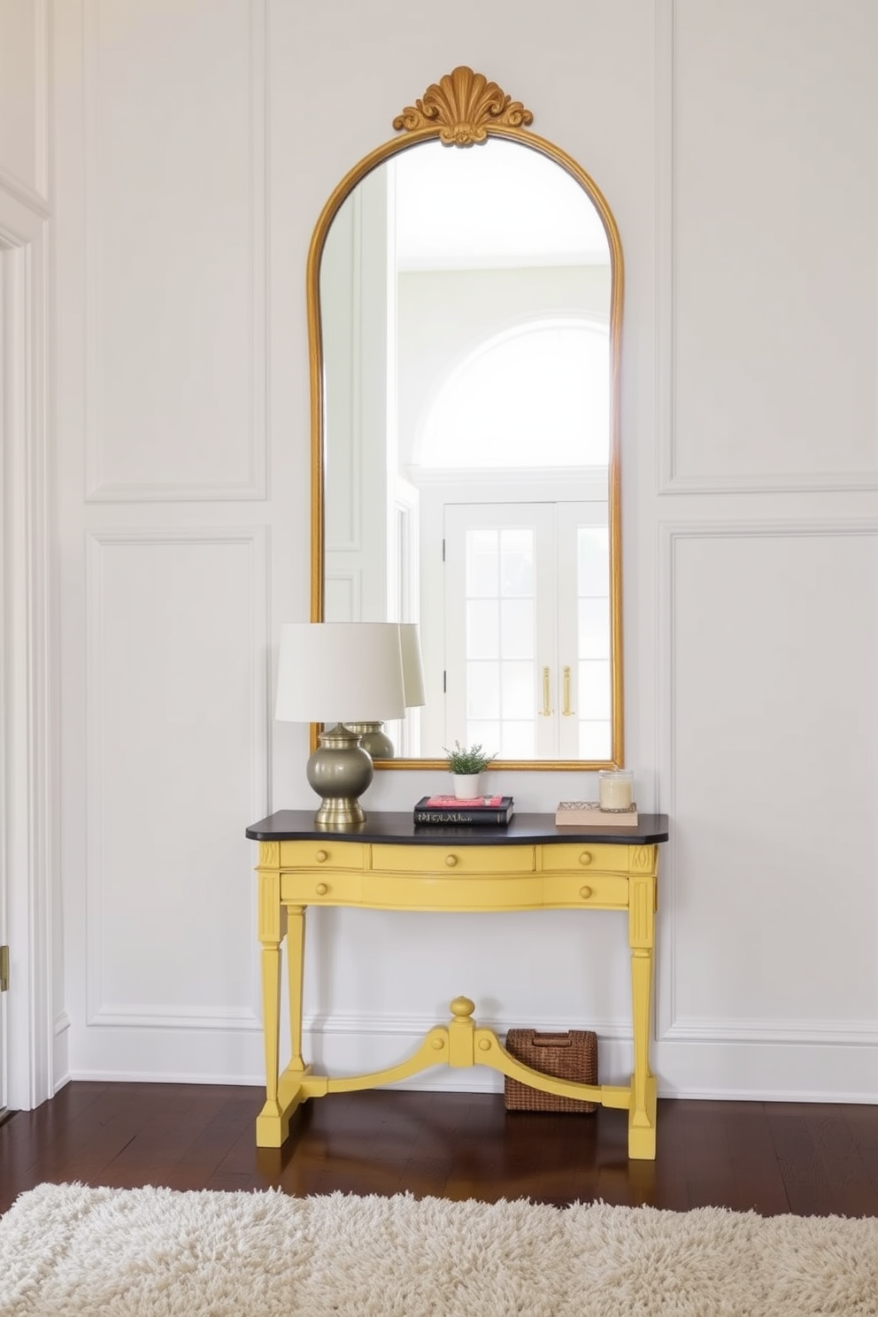 A vintage yellow mirror is the focal point of the foyer, reflecting natural light and creating a warm atmosphere. The walls are adorned with soft white paneling, complementing the mirror's vibrant hue and enhancing the space's elegance. The foyer features a classic console table beneath the mirror, topped with decorative items such as a stylish lamp and a small potted plant. A plush area rug in neutral tones anchors the space, adding texture and inviting comfort.