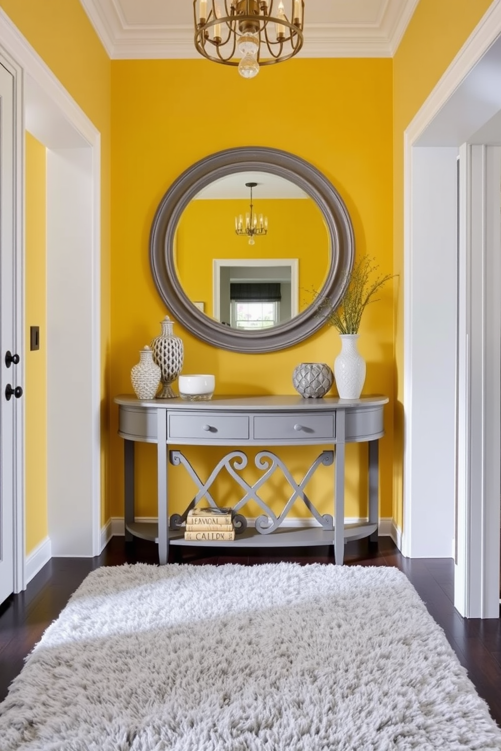 A stunning foyer with a yellow and gray color scheme that exudes elegance. The walls are painted a soft yellow, complemented by a gray console table adorned with decorative accents. A large round mirror with a gray frame hangs above the console table. A plush gray area rug lies beneath, adding warmth and texture to the space.