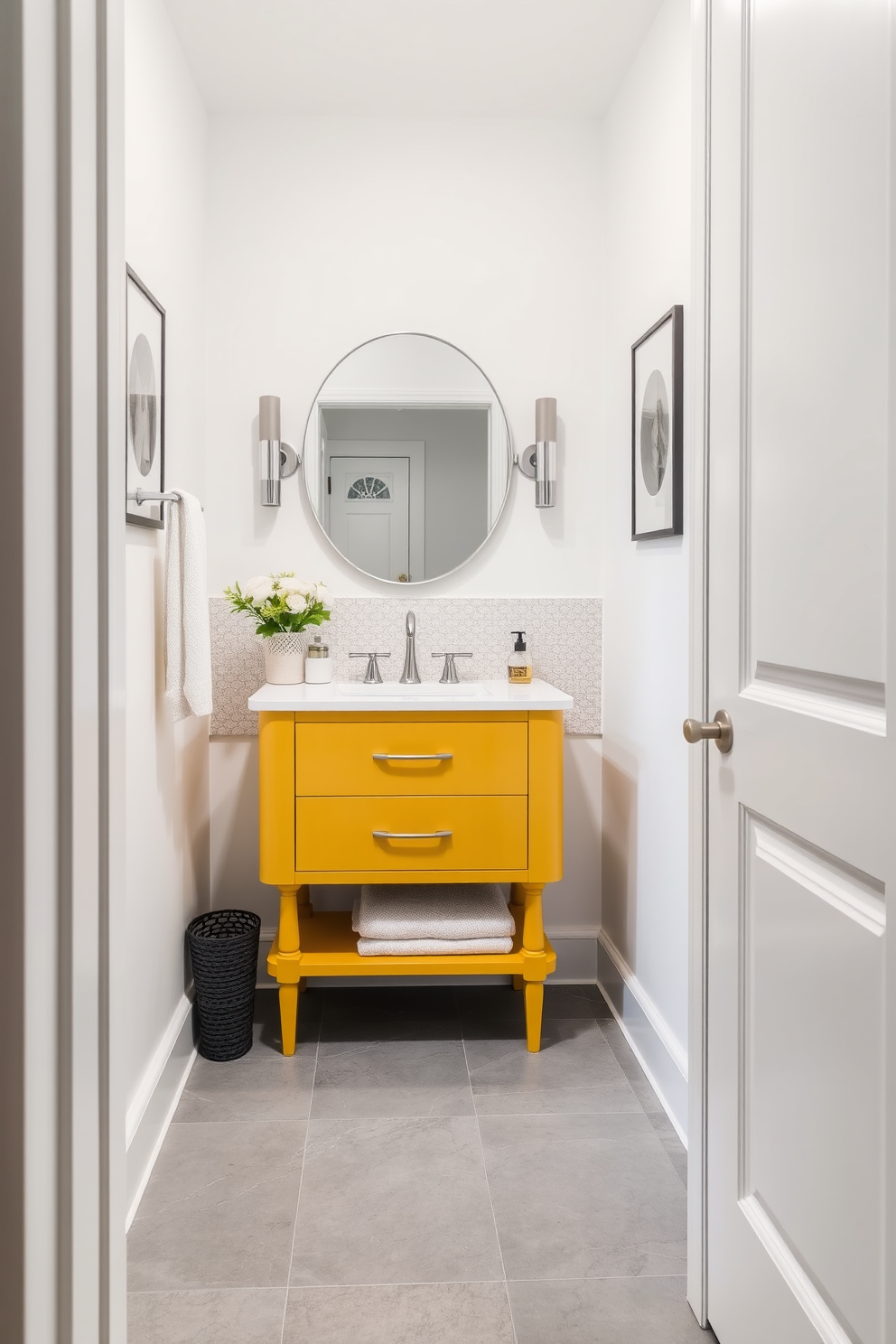 A stylish powder room featuring a mustard yellow vanity with a sleek gray tile floor. The walls are painted in a soft white, creating a bright and airy atmosphere.