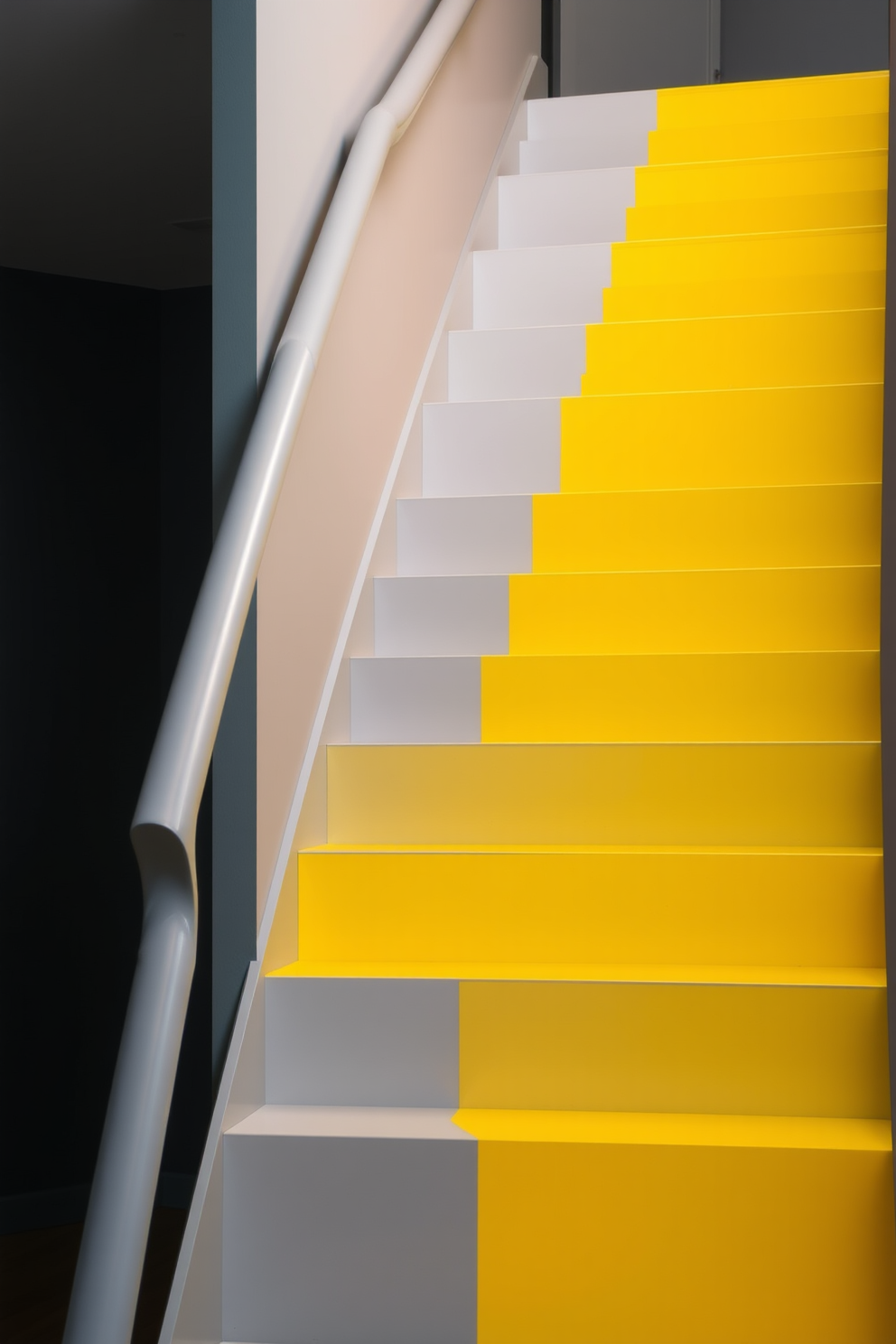 A stunning staircase design features a two-tone color scheme of bright yellow and soft gray. The yellow steps are complemented by a sleek gray railing that adds a modern touch to the overall aesthetic.