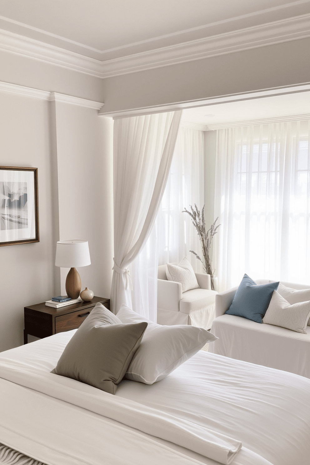 A serene bedroom space designed for relaxation. The walls are painted in soft pastel hues, and a plush king-sized bed is dressed in crisp white linens with an assortment of calming blue and gray pillows. Natural light filters through sheer curtains, illuminating a cozy reading nook with a comfortable armchair and a small side table. Essential oil diffusers are strategically placed, filling the air with soothing scents of lavender and chamomile, creating an inviting atmosphere for rest and tranquility.